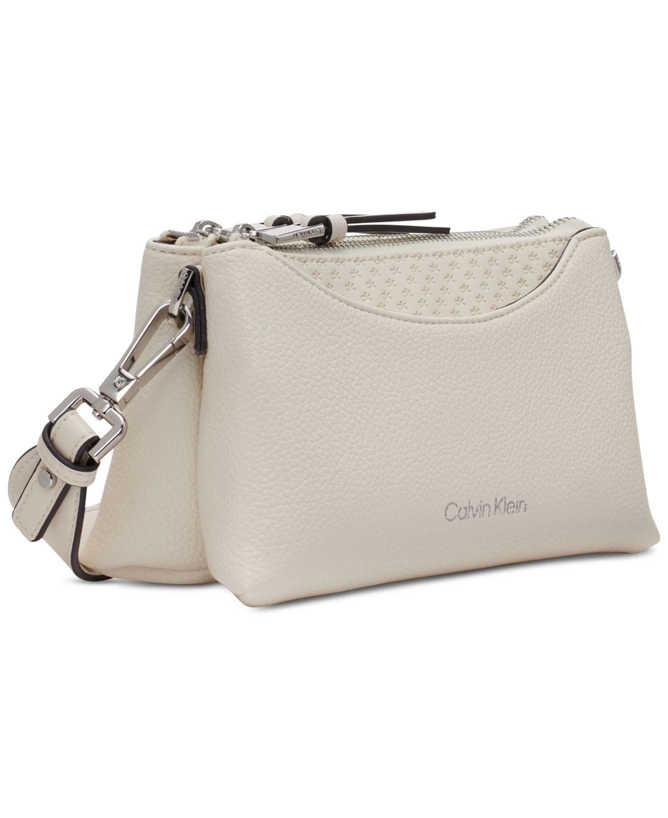 Calvin Klein Chrome Embossed Signature Zippered Crossbody in Natural | Lyst