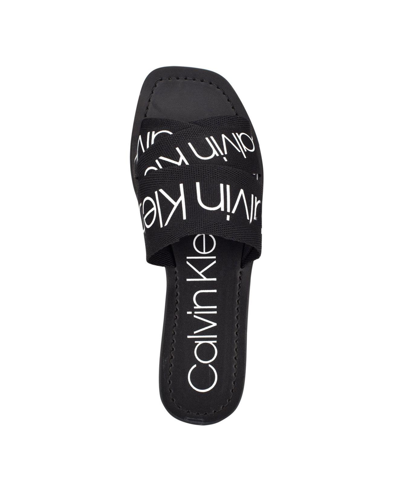 Calvin Klein Bainy Criss-cross Strap Slides Flat Sandals in Black | Lyst