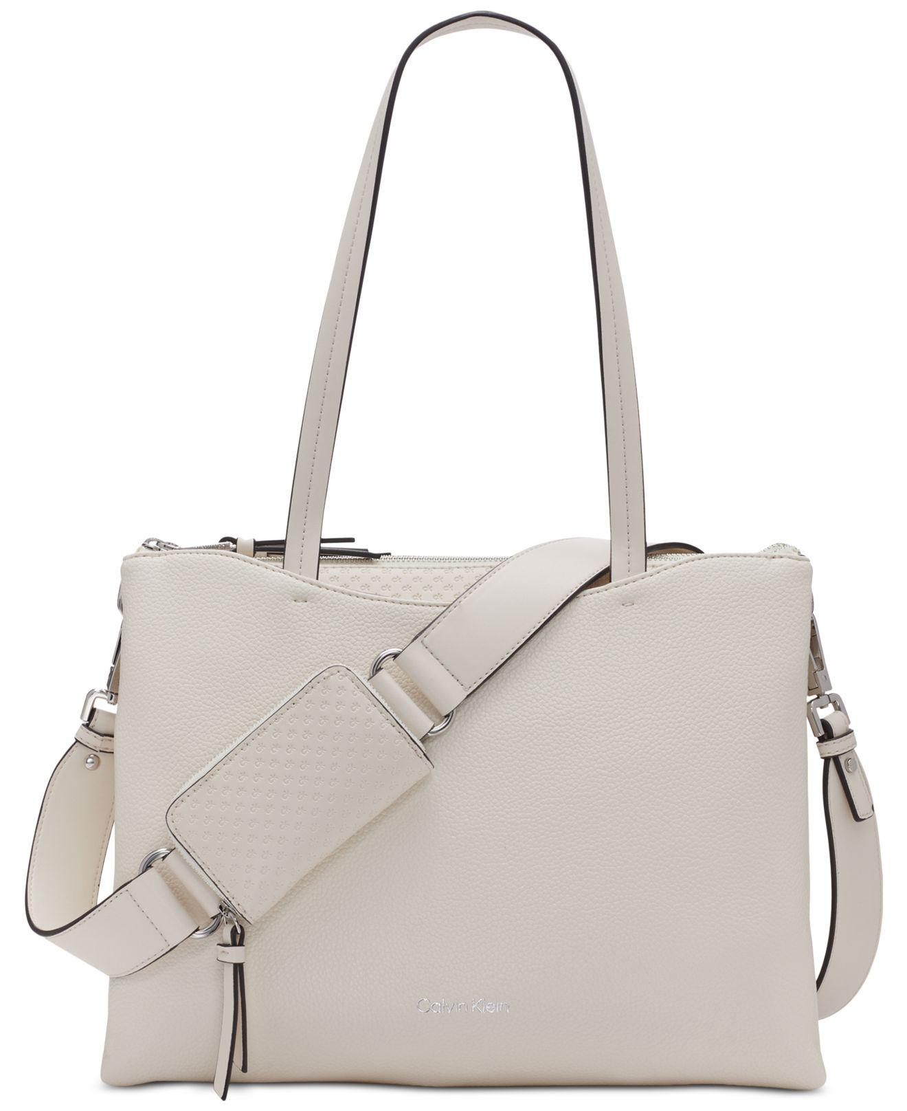 Calvin Klein Chrome Embossed Signature Top Zipper Convertible Tote in