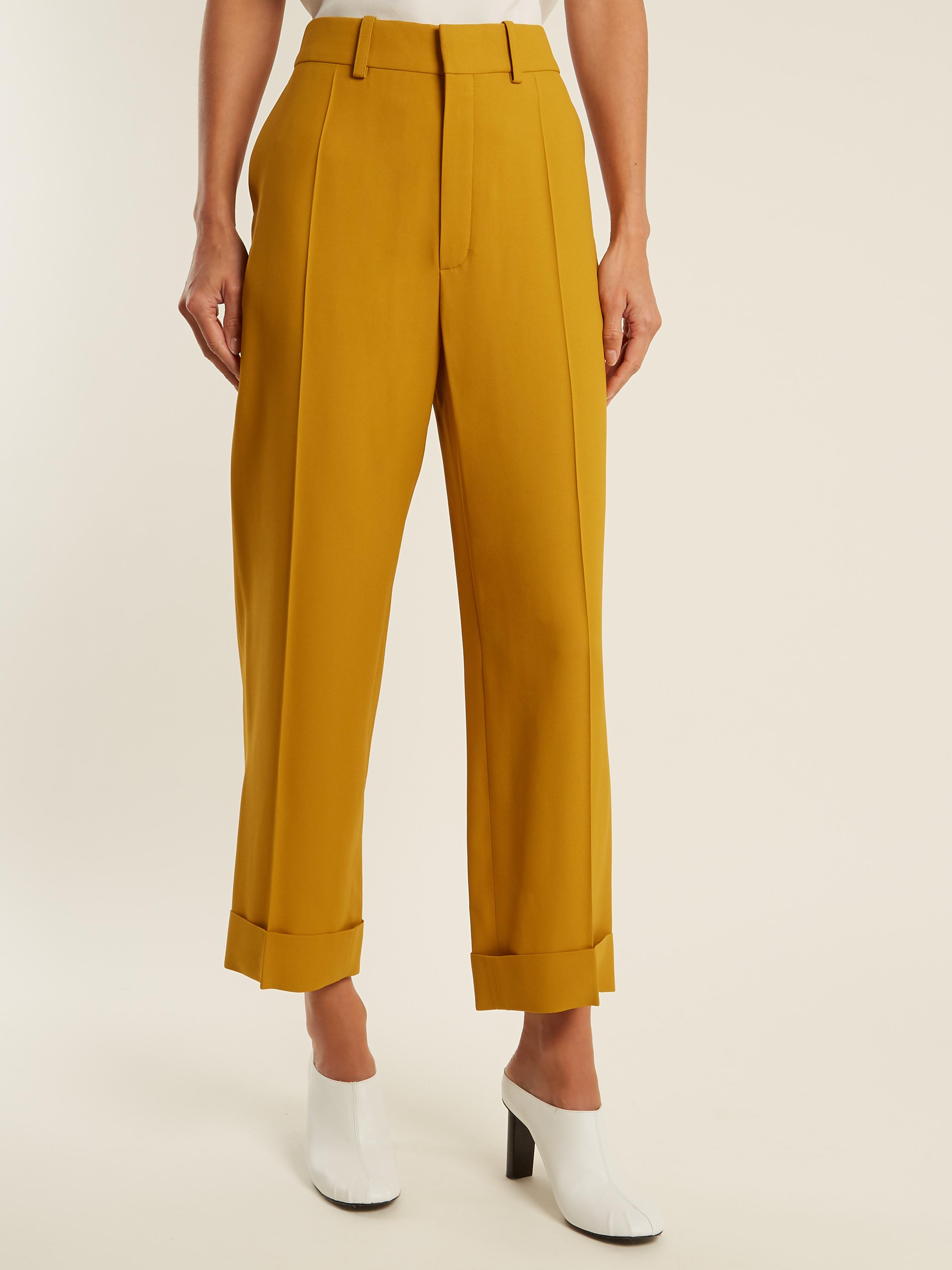 yellow cropped trousers