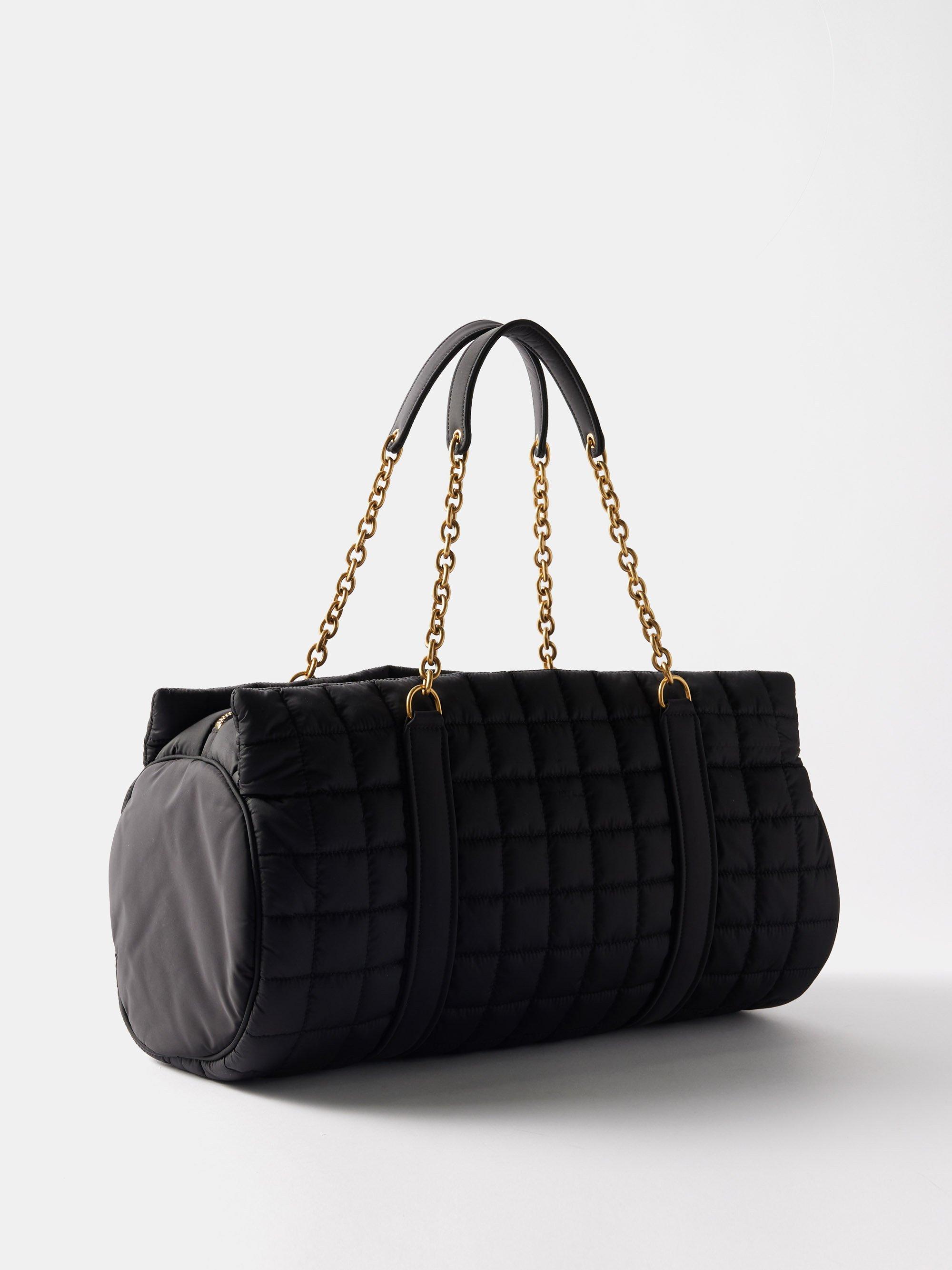 Saint Laurent Gloria Ysl-plaque Quilted-shell Travel Bag in Black