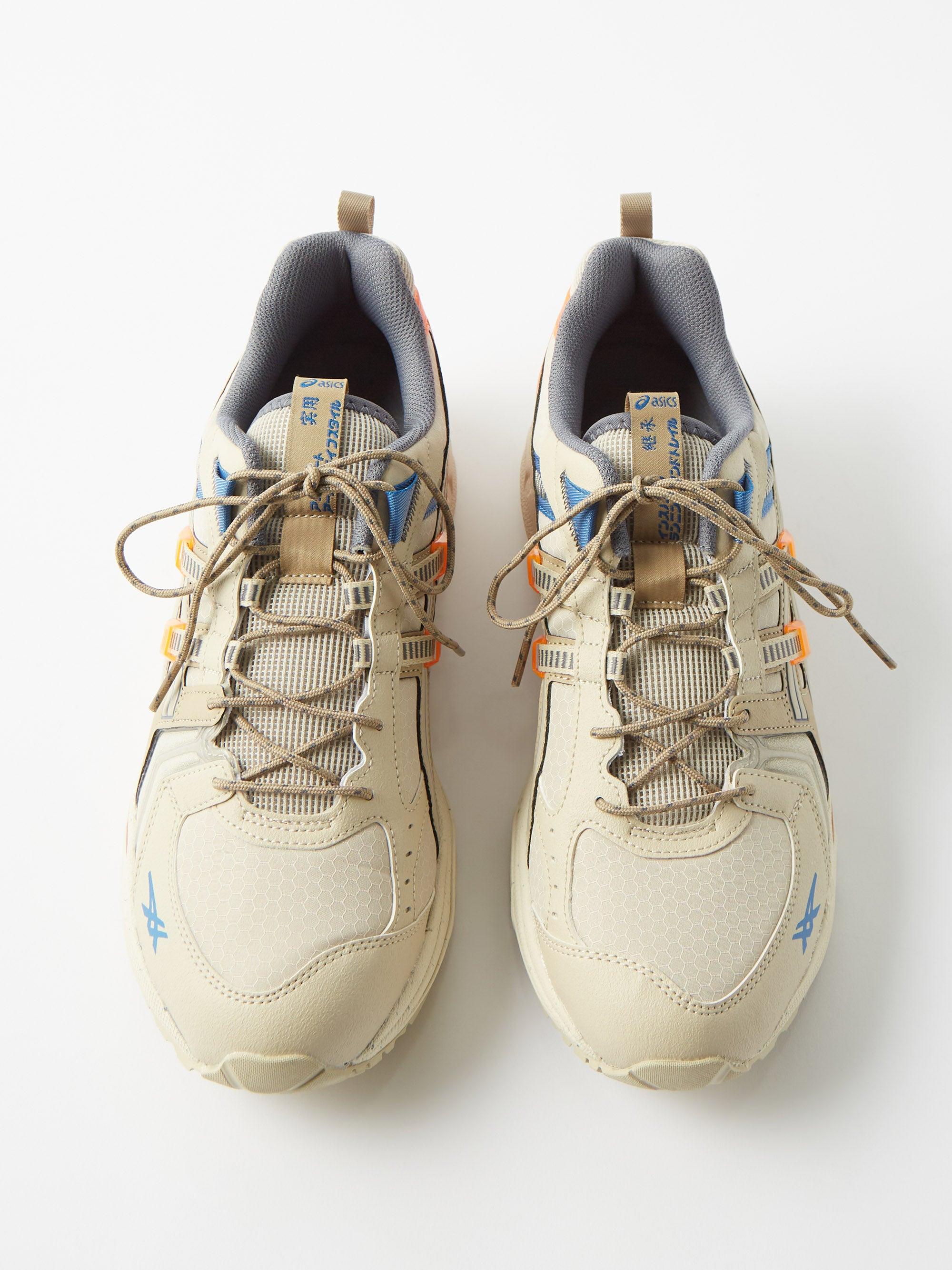 beige running trainers