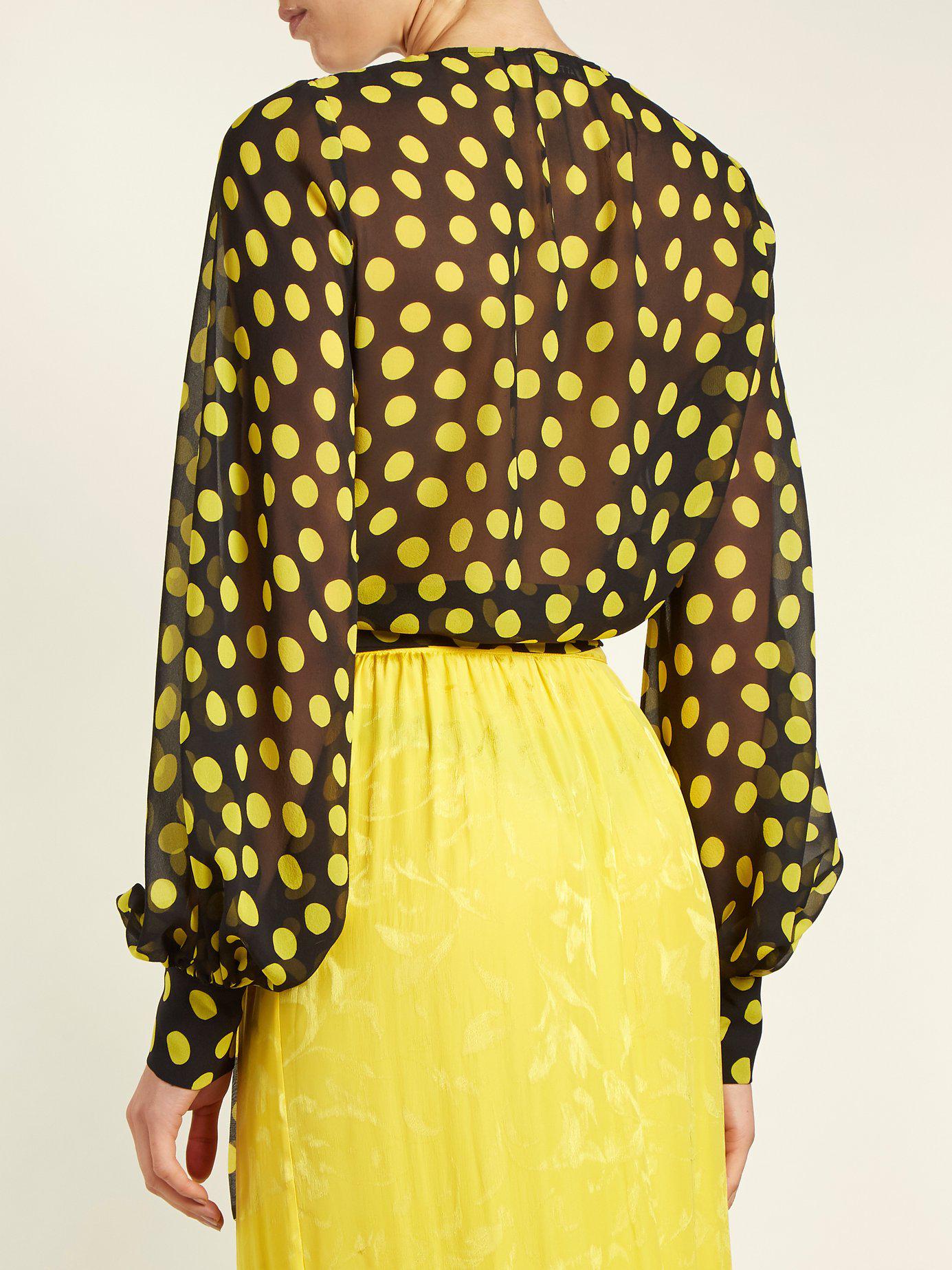 yellow top with black polka dots