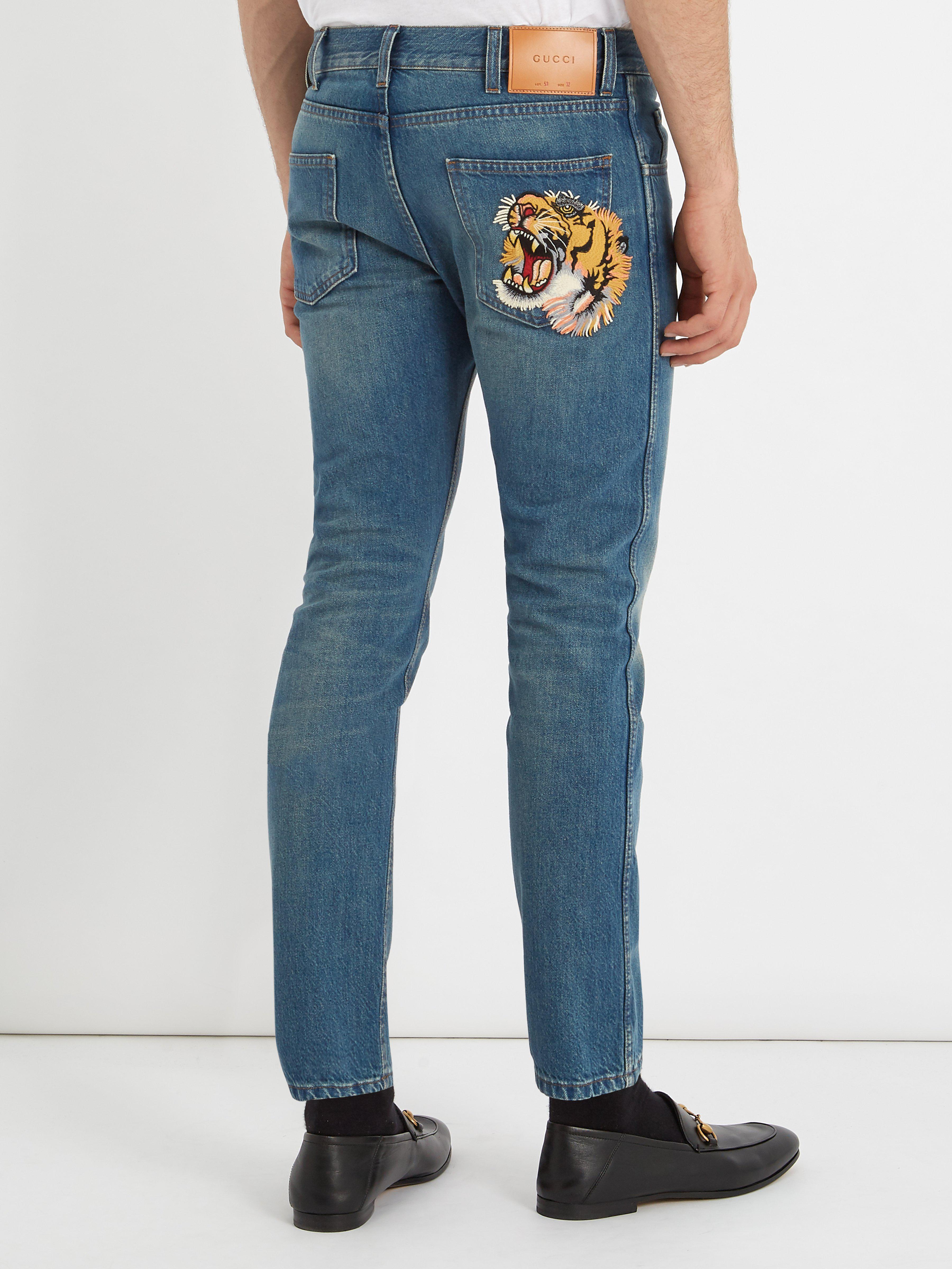 Gucci Tiger-embroidered Mid-rise Tapered-leg Jeans in Blue for Men | Lyst  Australia