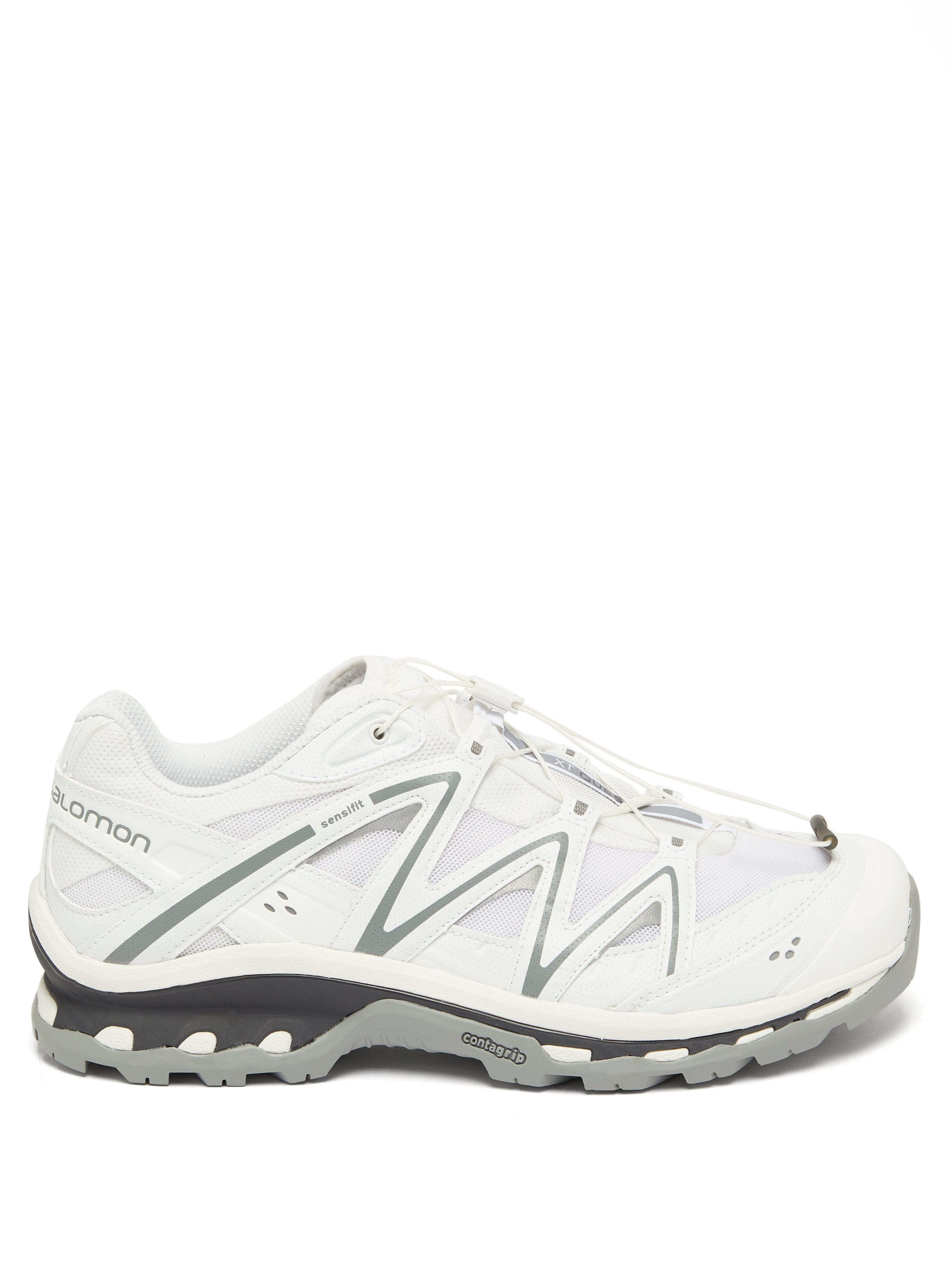 white salomon trainers