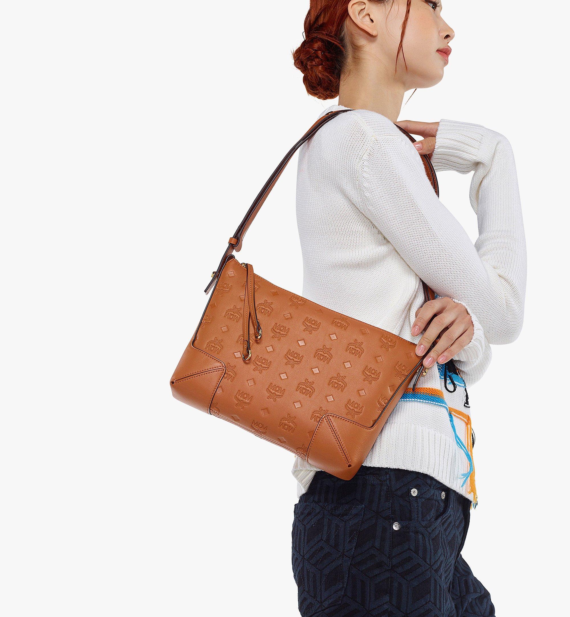 Mcm Klara Embossed Leather Crossbody In Black/cognac