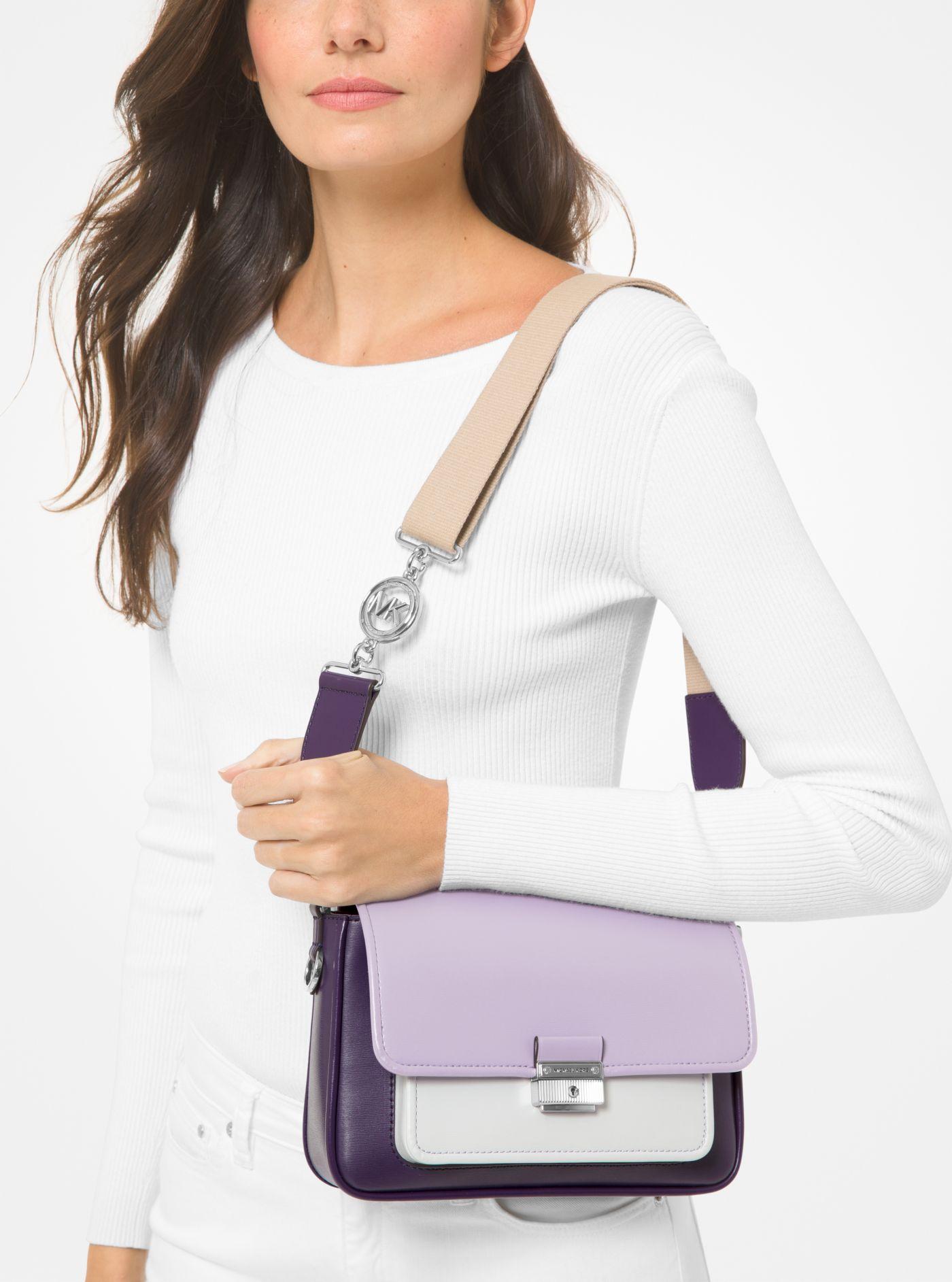 Michael Kors Bradshaw Medium Color-block Leather Messenger Bag in Purple |  Lyst