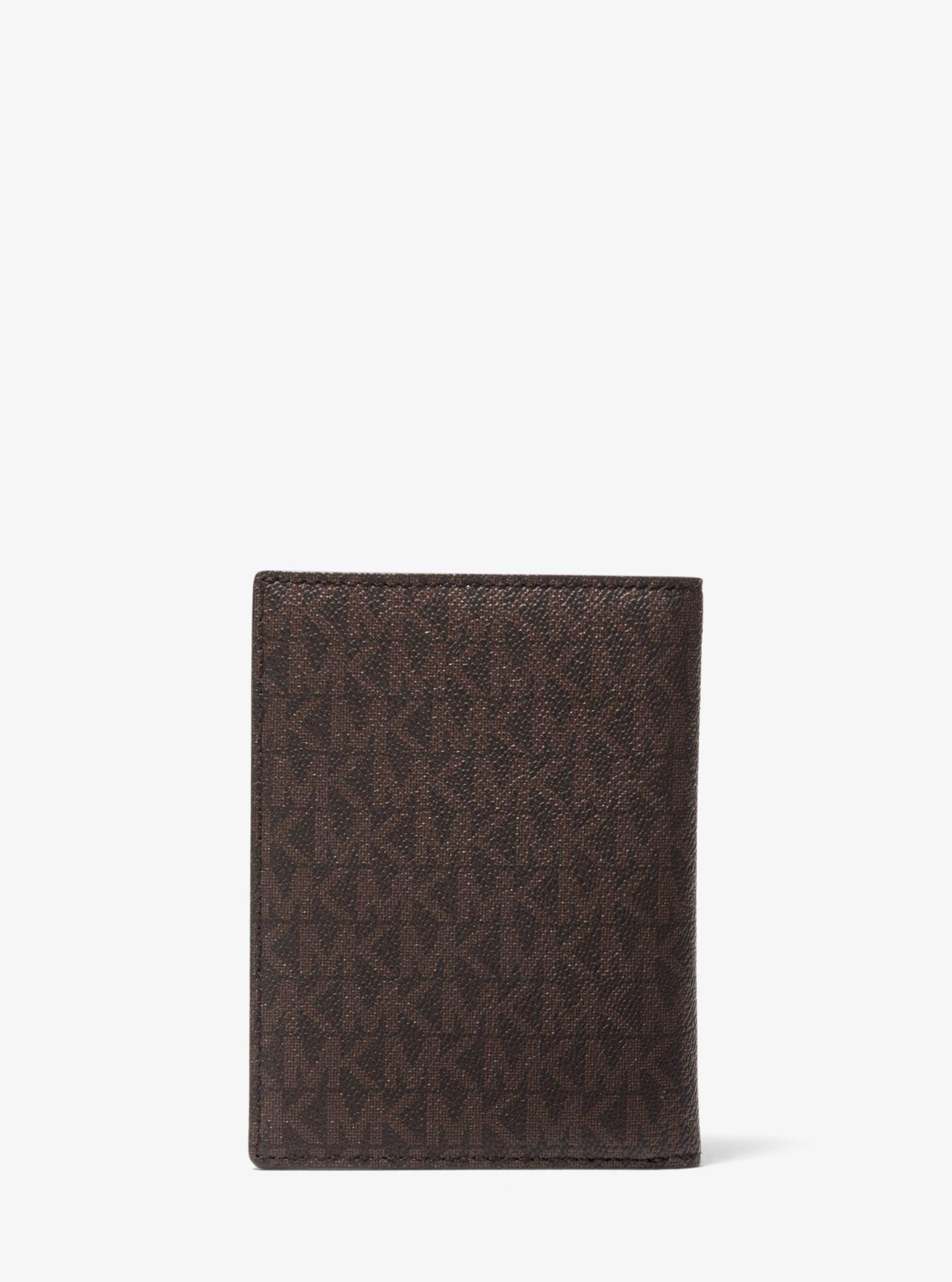 Michael Kors Bedford Travel Medium Logo Stripe Passport Wallet in Brown