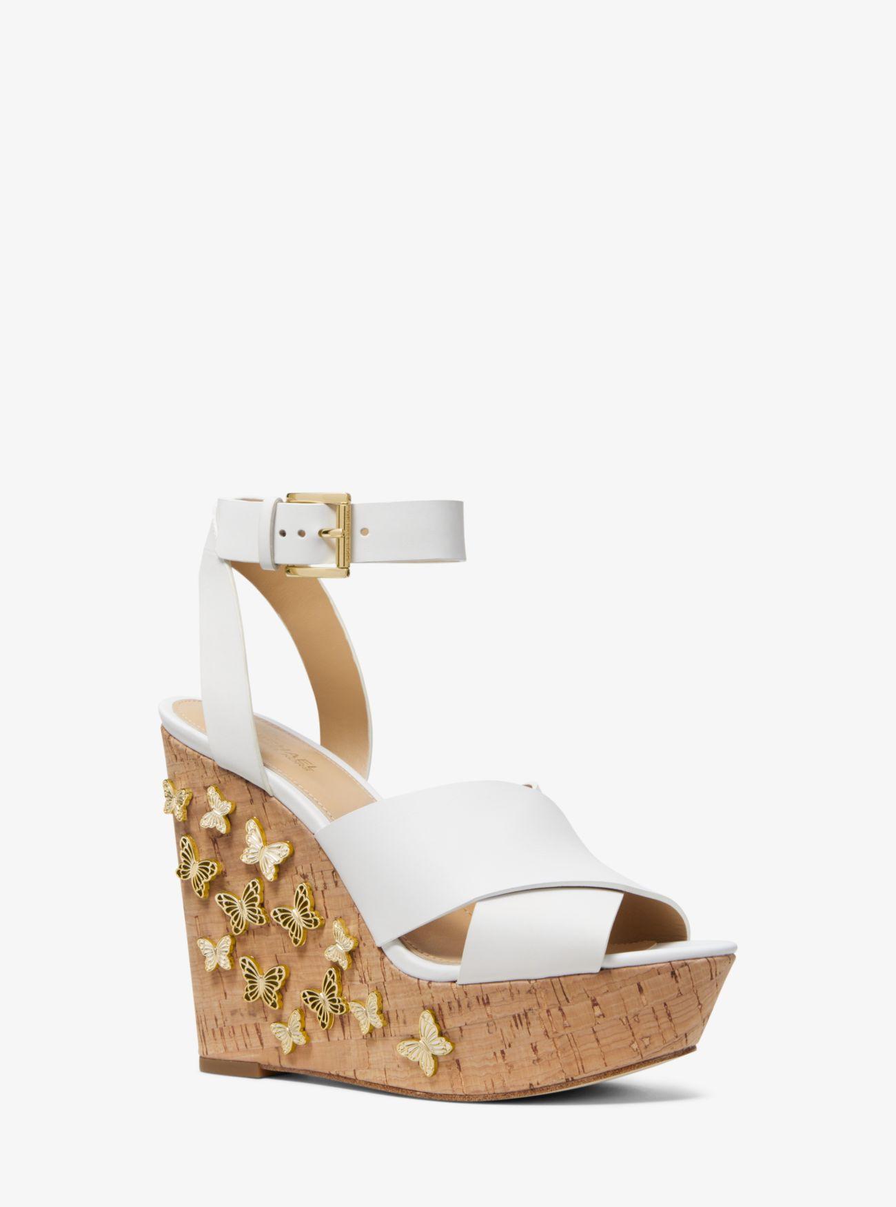 lacey butterfly embellished leather wedge