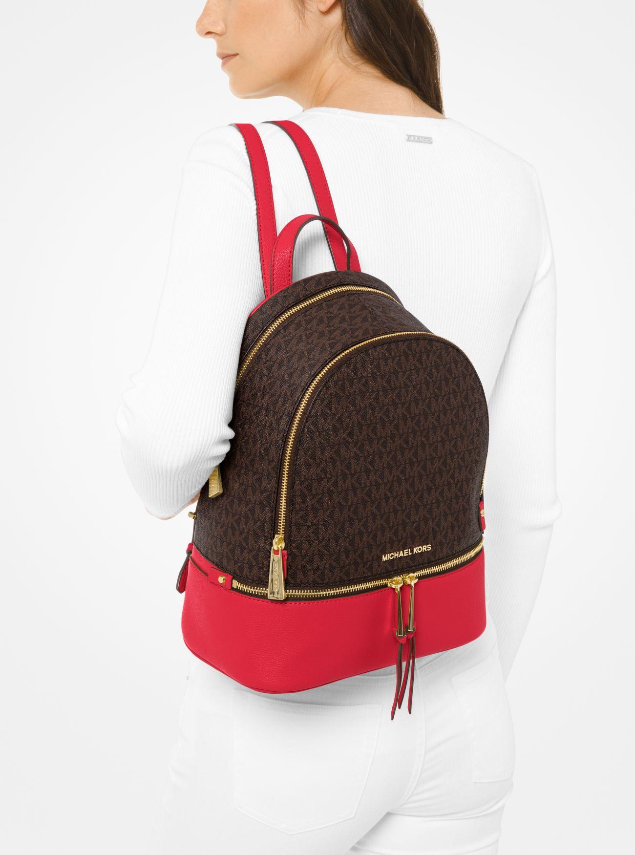 Michael Kors Rhea Medium Logo And Pebbled Leather Backpack in Red 