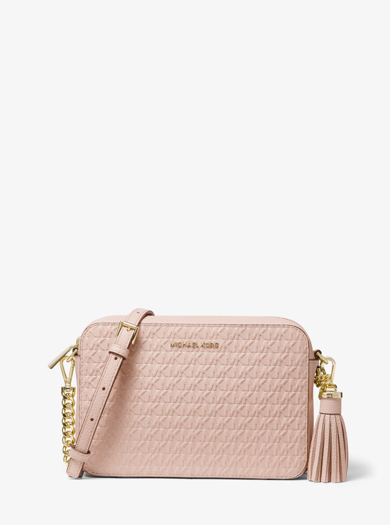 Michael Kors Ginny Medium Logo Debossed Pebbled Leather Crossbody Bag in  Pink - Lyst