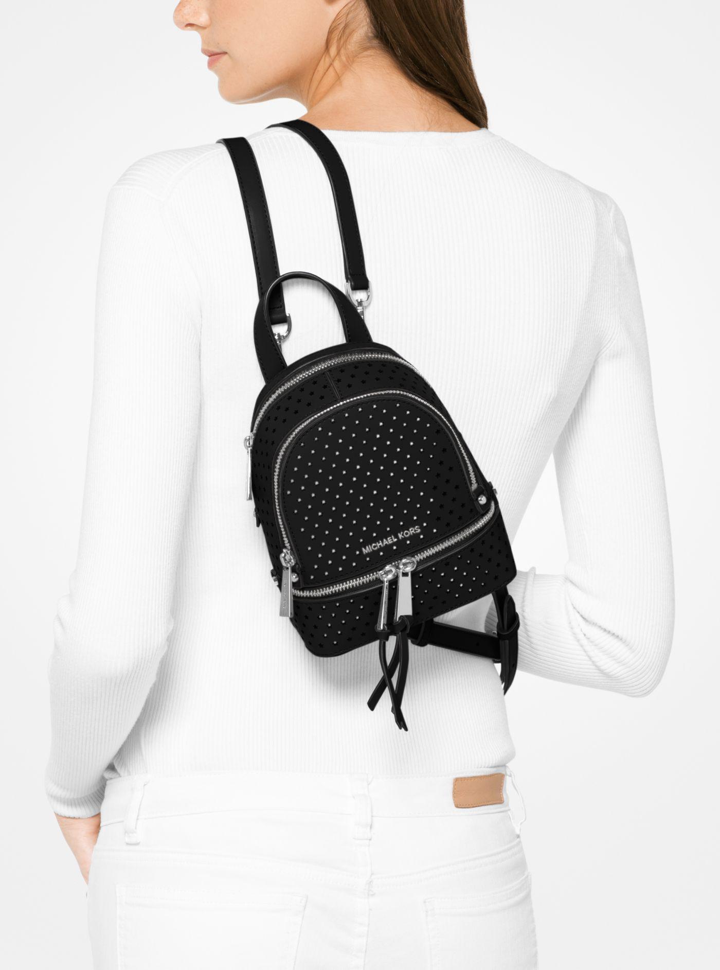 Michael Kors Rhea Mini Perforated Leather Backpack in Black | Lyst