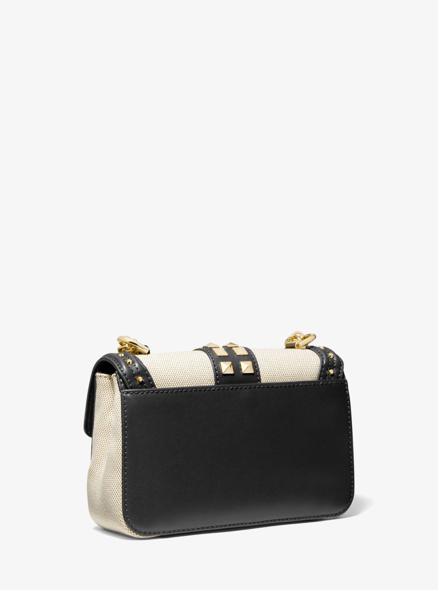 soho small studded leather and canvas shoulder bag