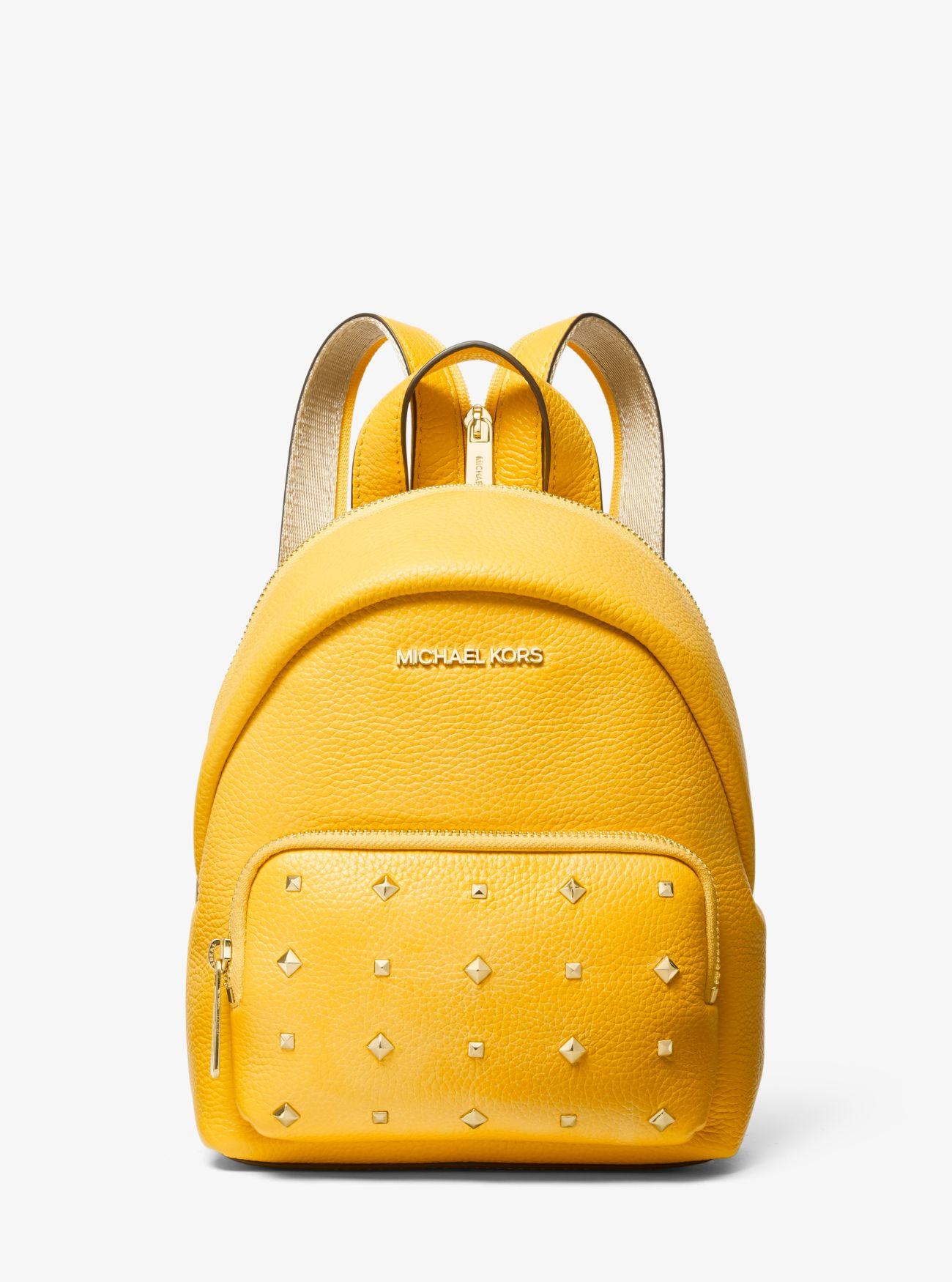 Mochila transformable Erin pequeña de piel con tachuelas Michael Kors de  Cuero de color Amarillo | Lyst