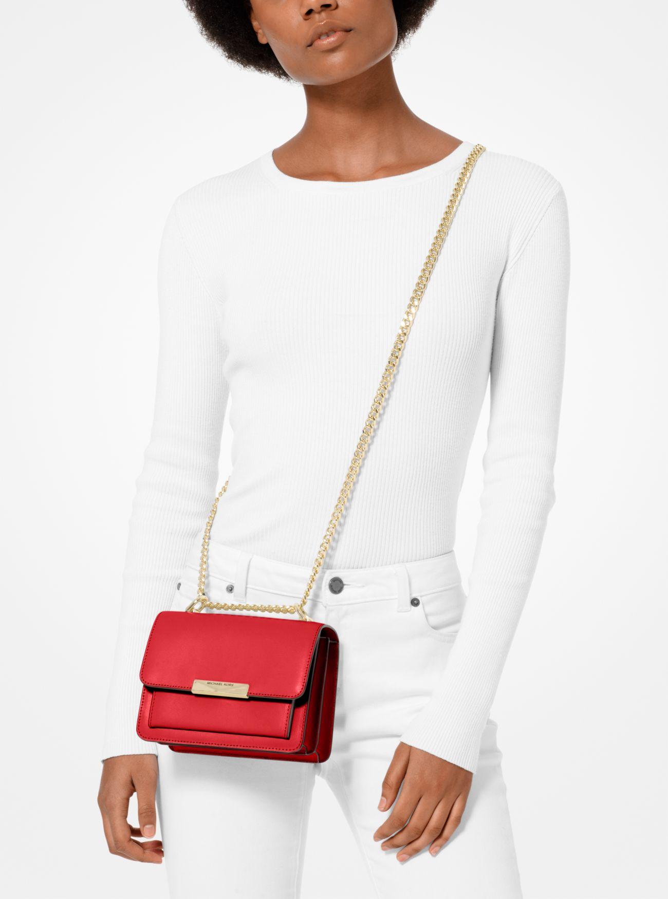 small red leather crossbody bag