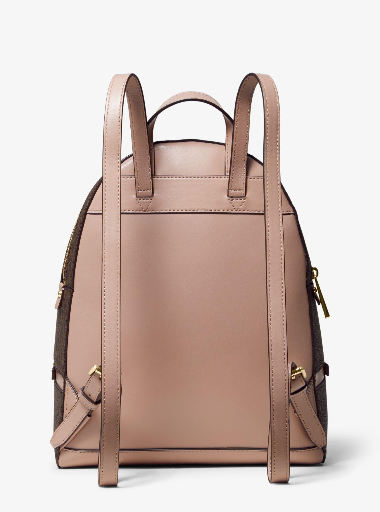 Zaino Rhea medio in pelle con logo e righeMichael Kors in Pelle di colore  Marrone | Lyst