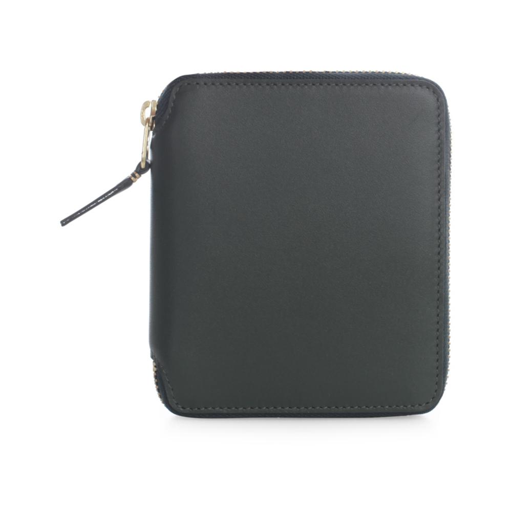 comme des garcons zip around wallet que significa