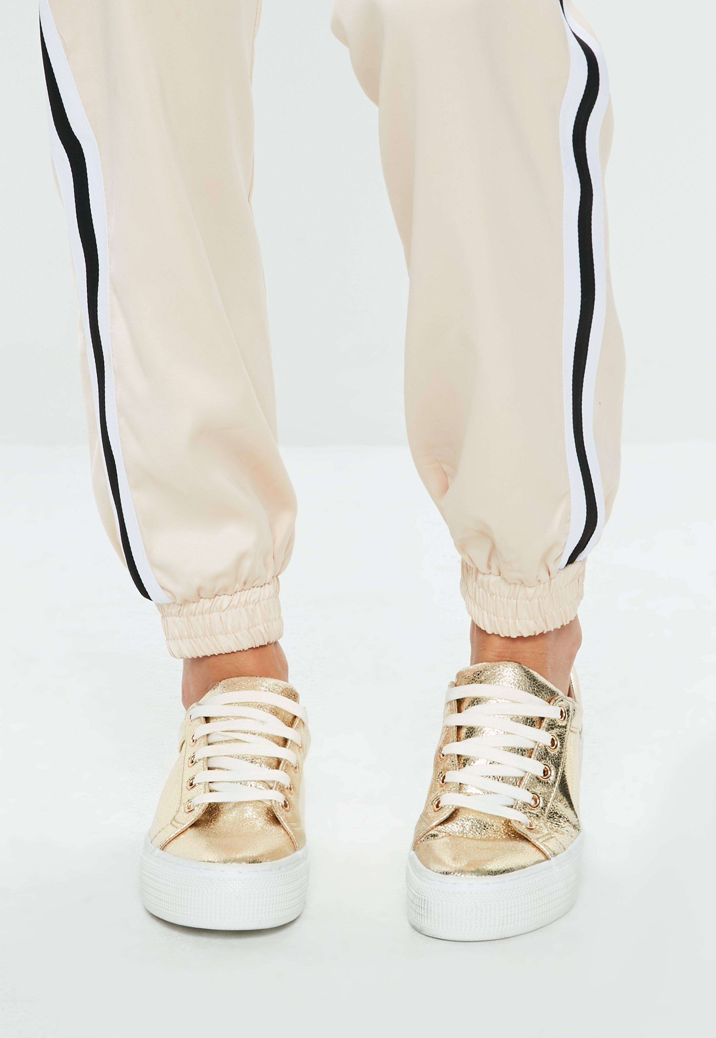 gold flatform trainers