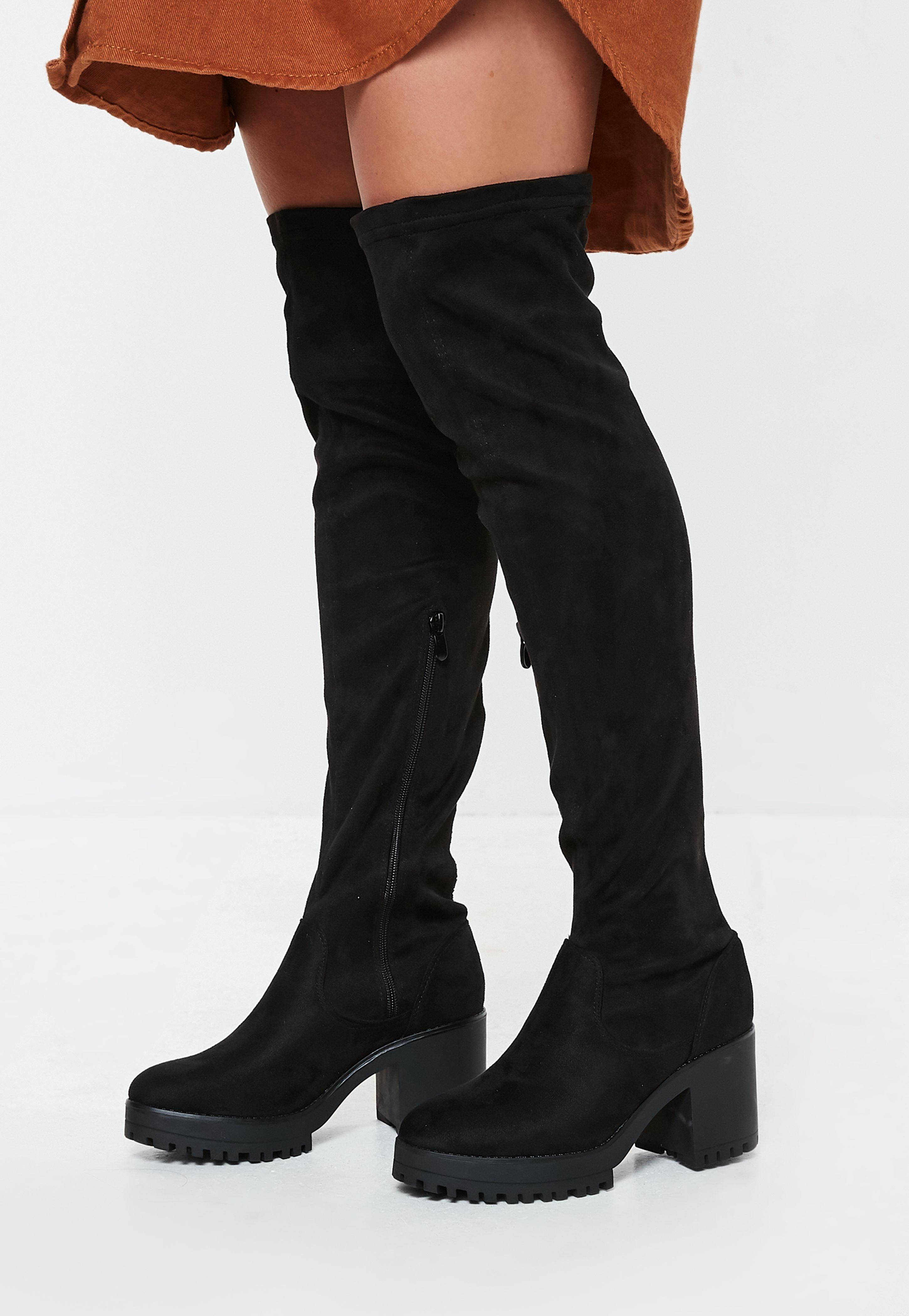 black cleated sole over the knee boots