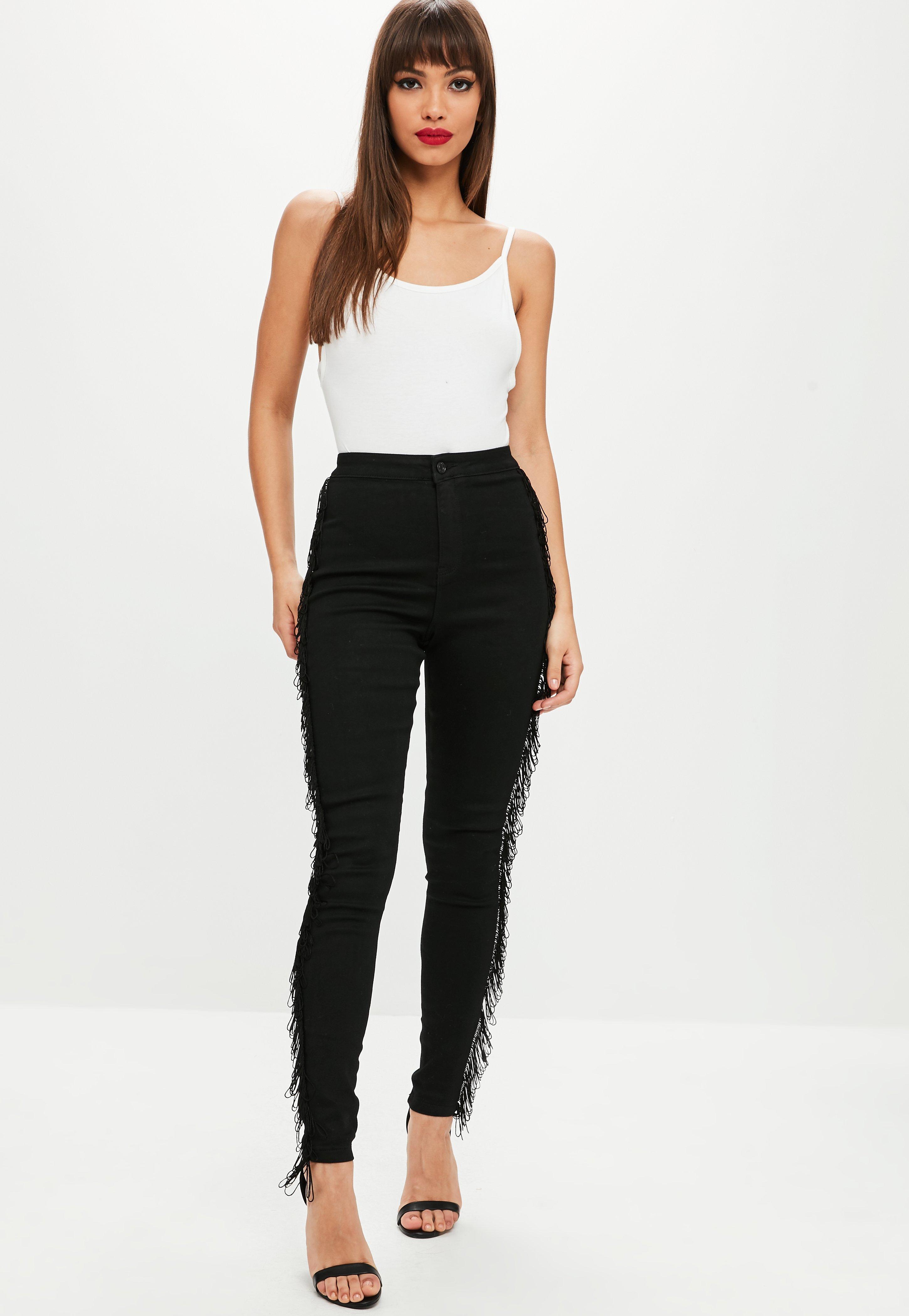black jeans with fringe on the side