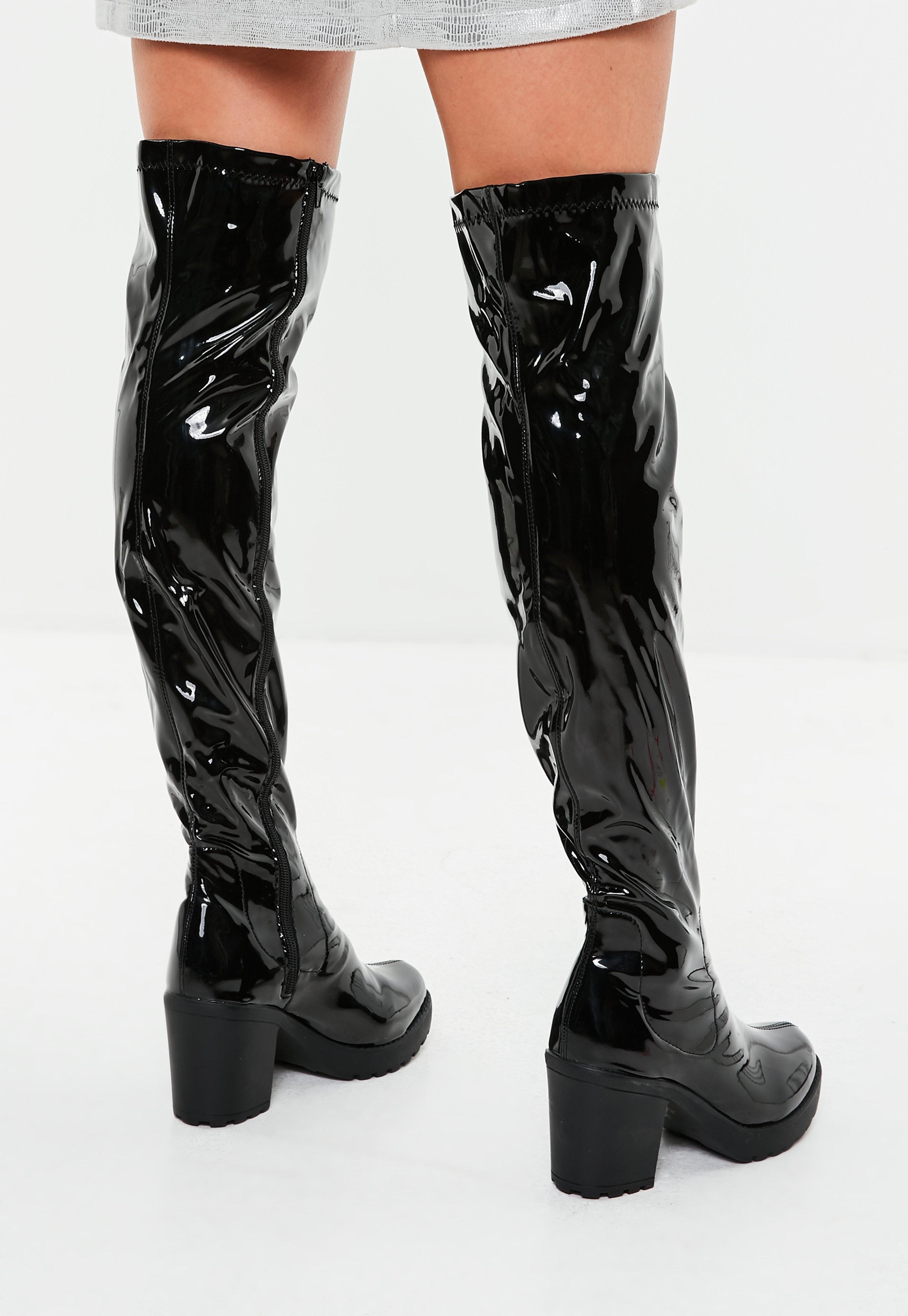 black cleated sole over the knee boots