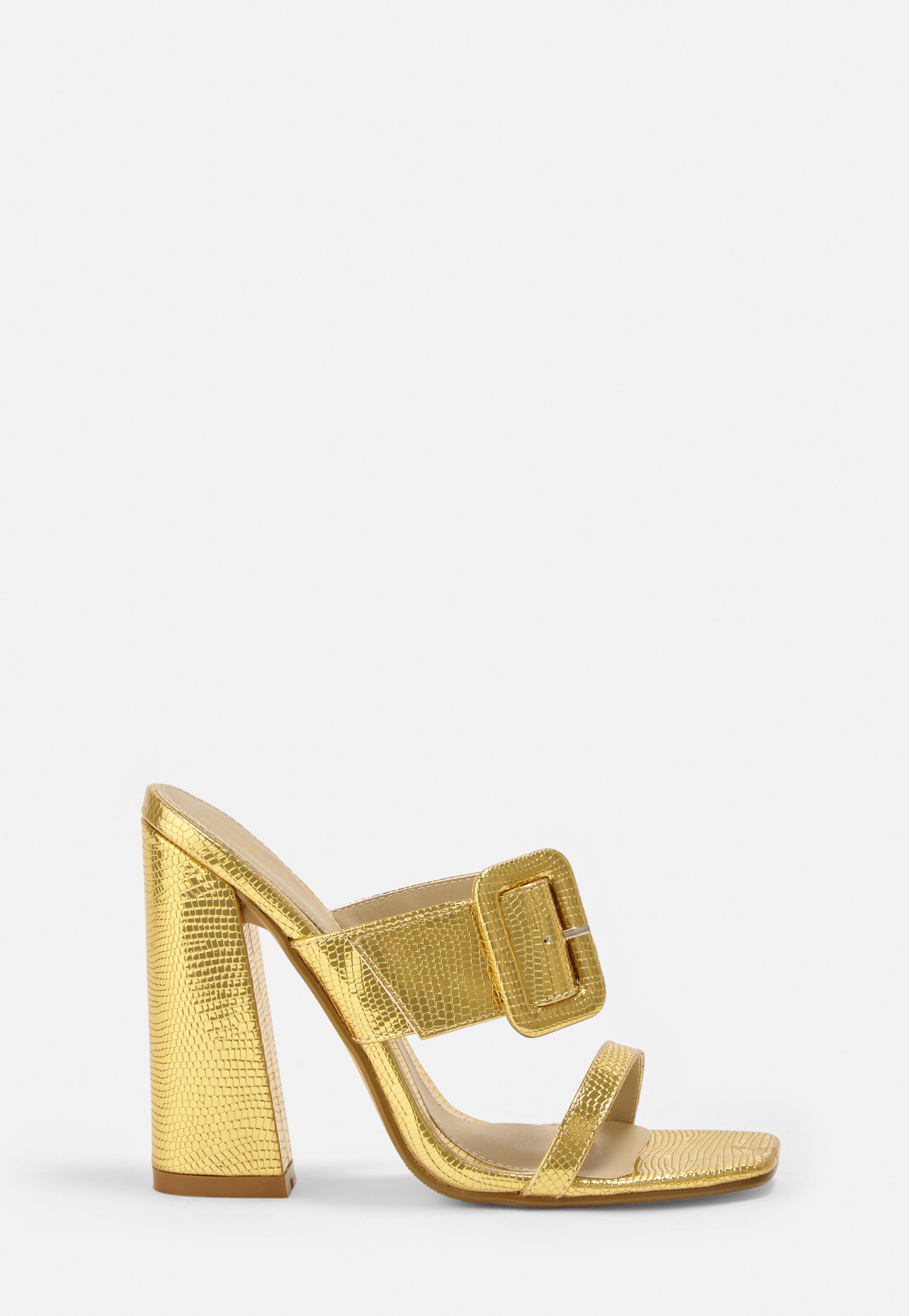 mules with gold buckle