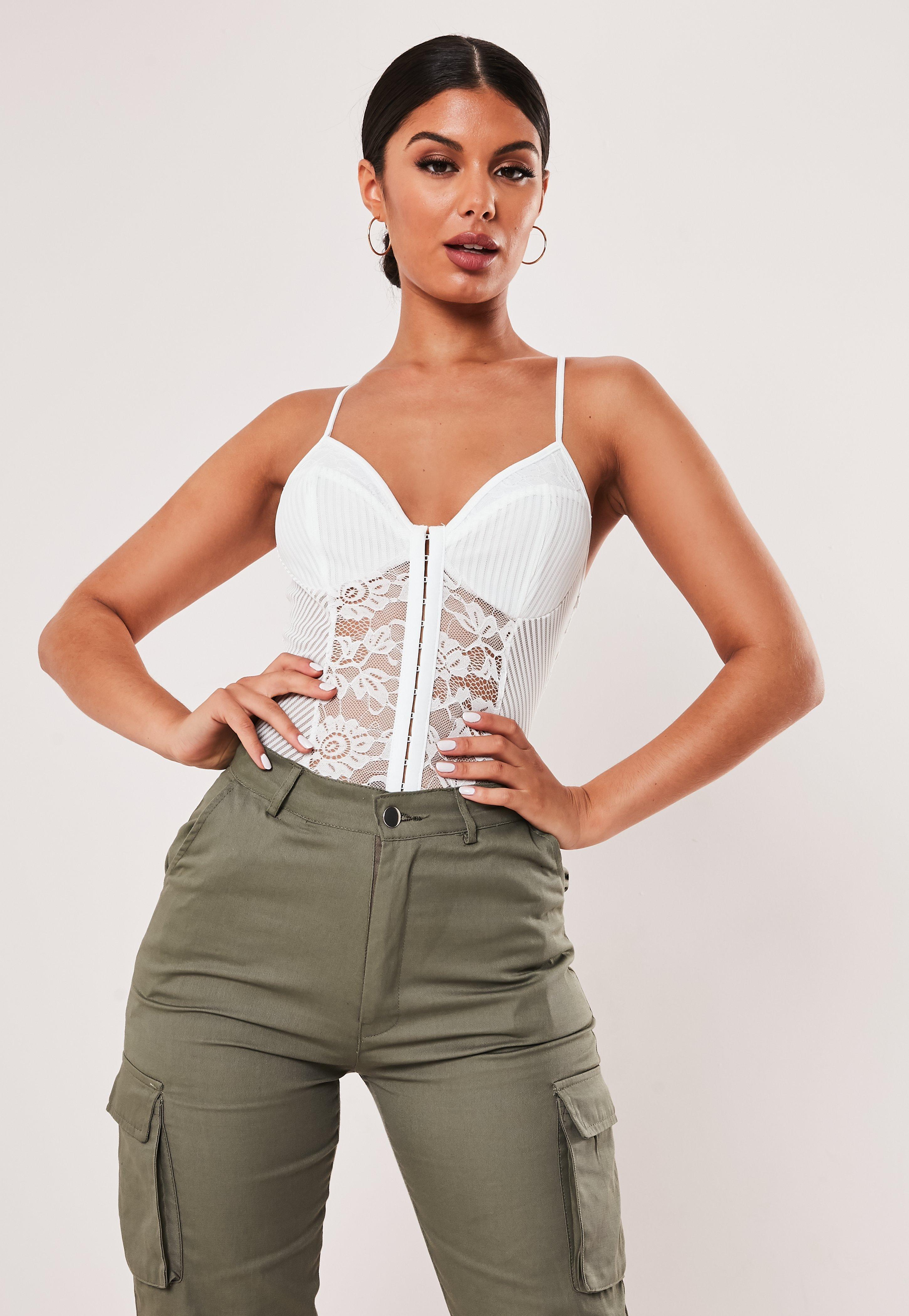 lace bodysuit and cargo pants