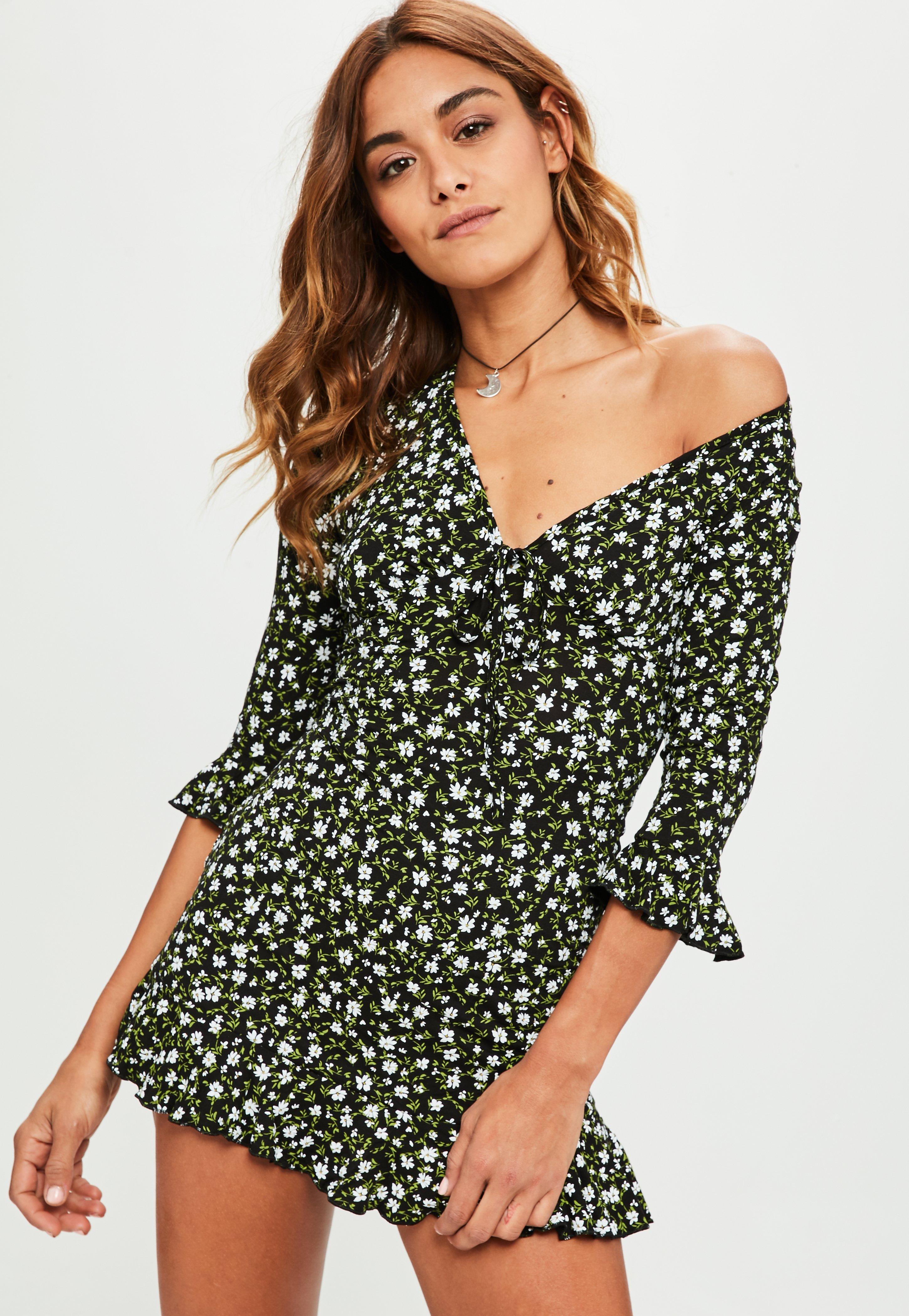 black daisy print frill tea dress