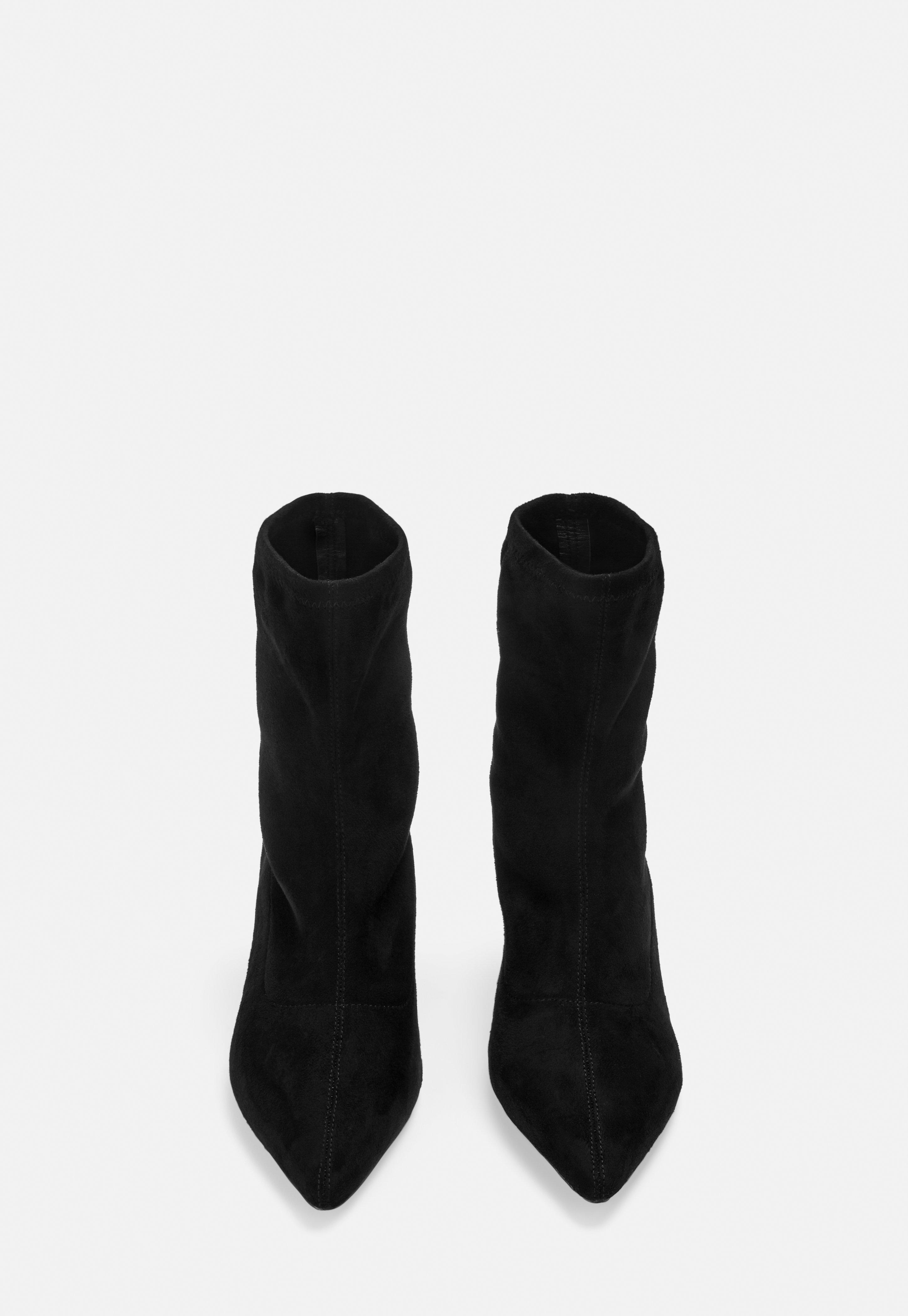 black pointed toe sock boots
