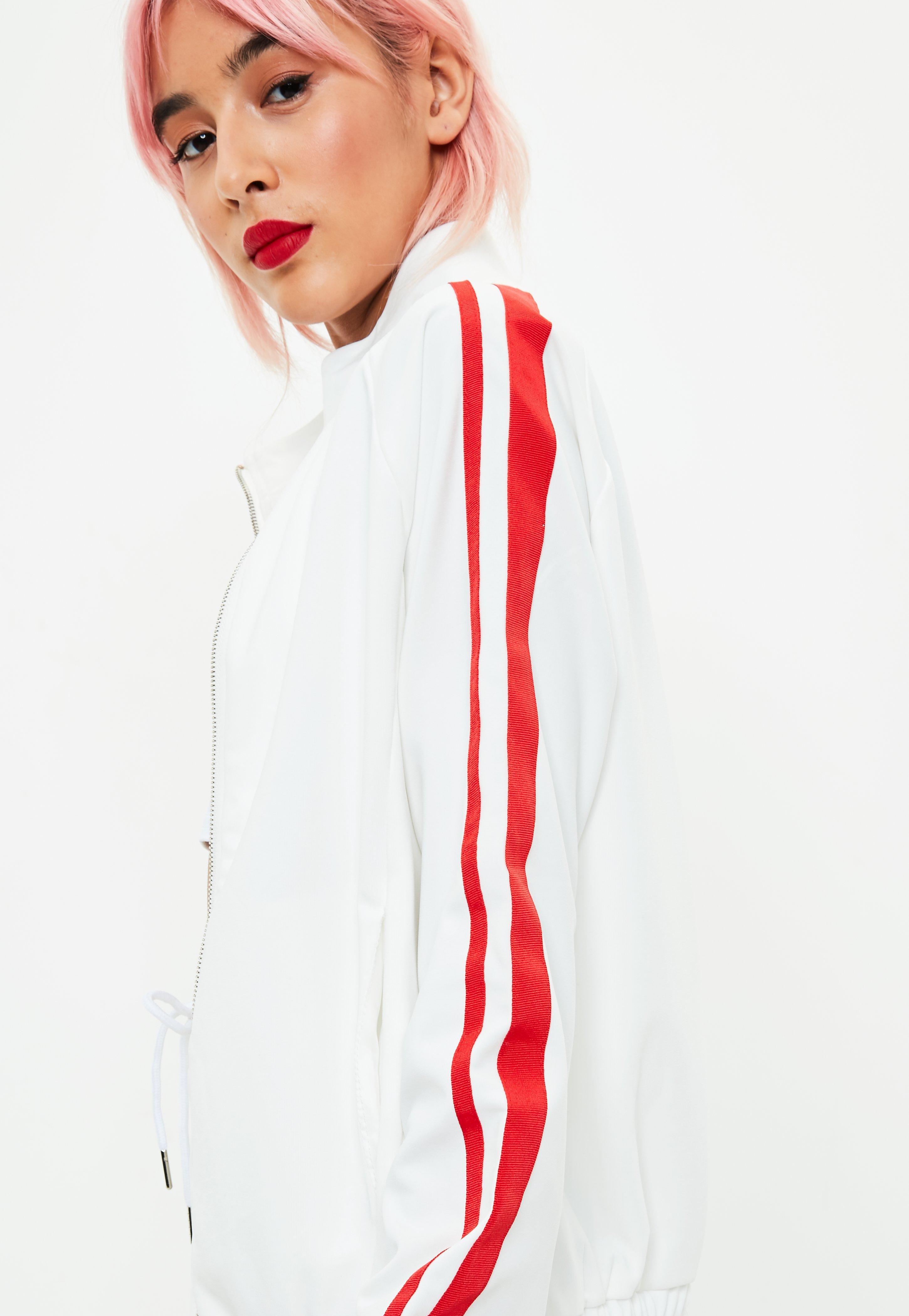 white tracksuit with red stripes
