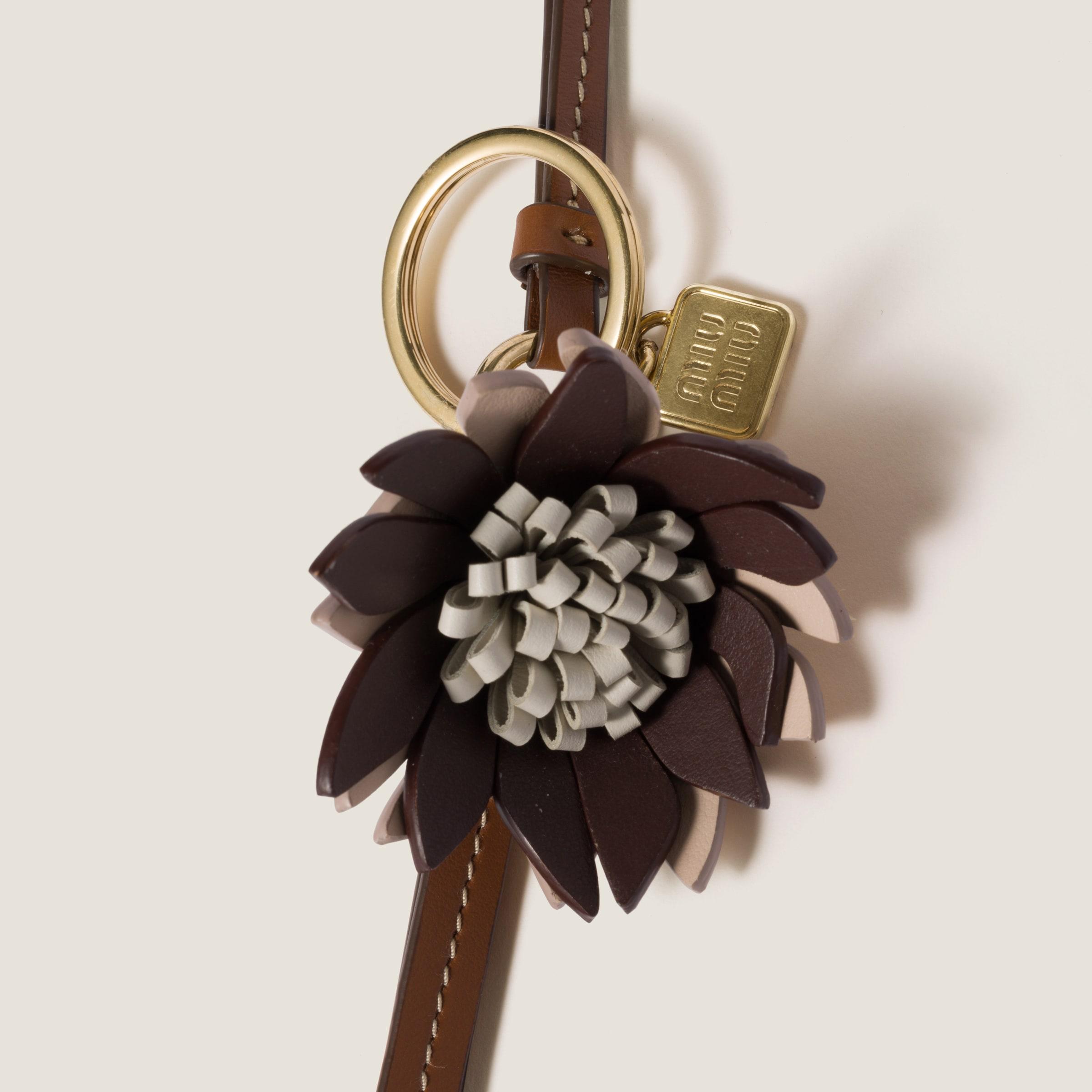 【MiuMiu】Trick leather keyring Miu Miu Trick Leather Keyring in Natural | Lyst