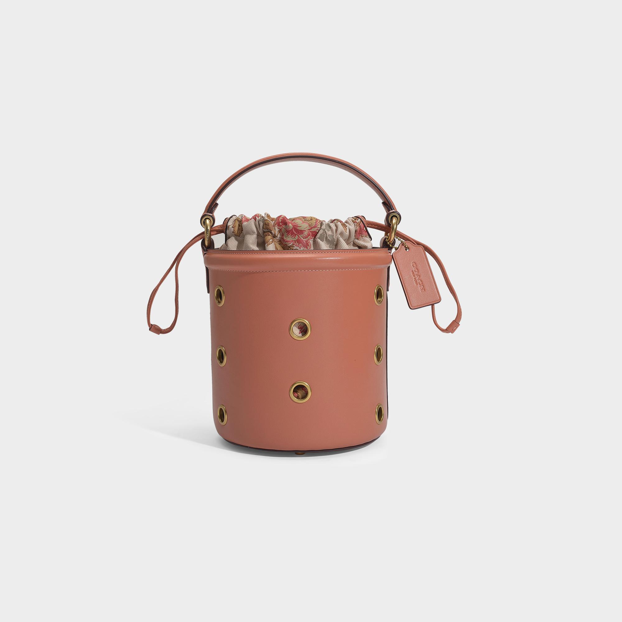COACH Grommets Drawstring Bucket Bag In Pink Calfskin in Pink - Lyst