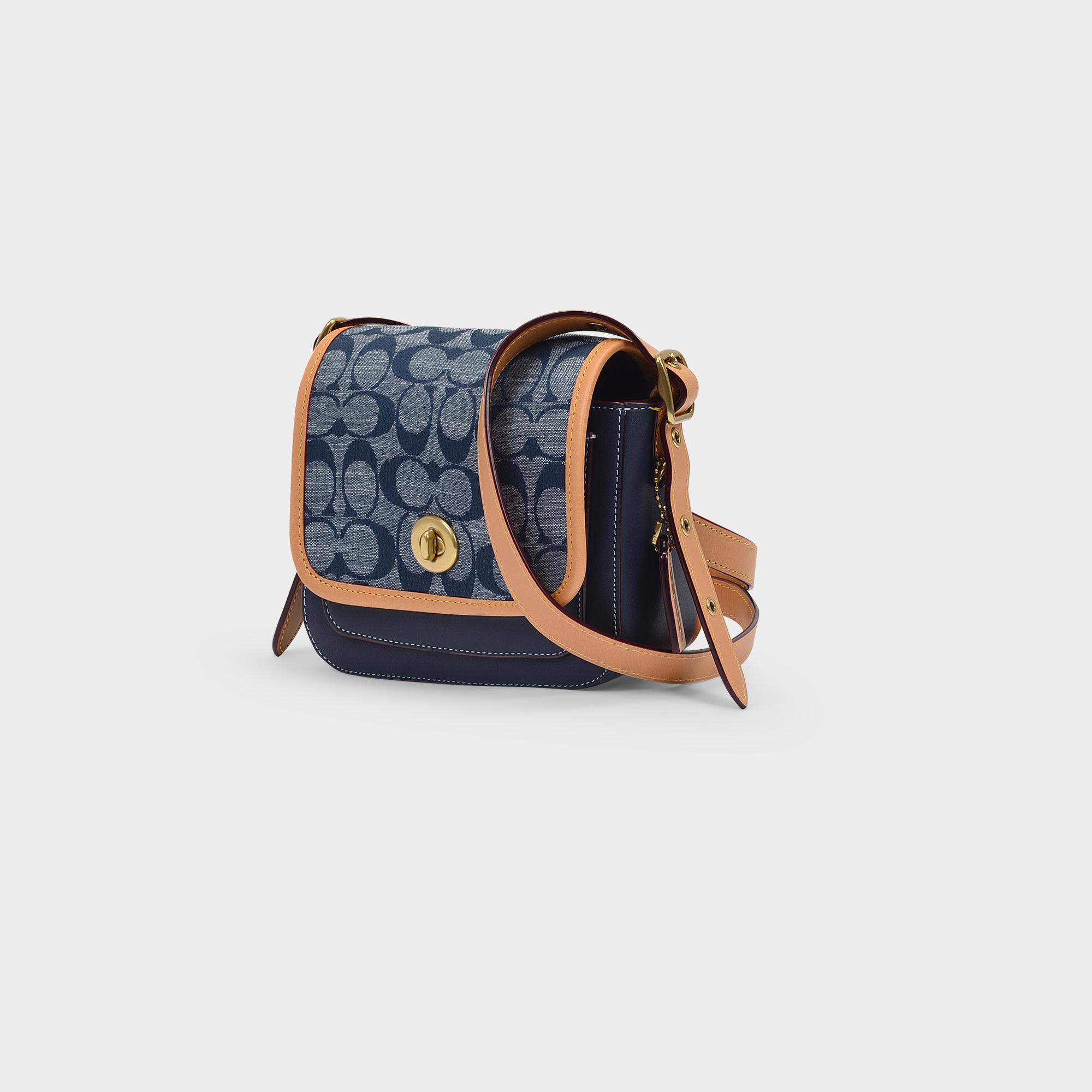 rambler crossbody 16 in signature canvas
