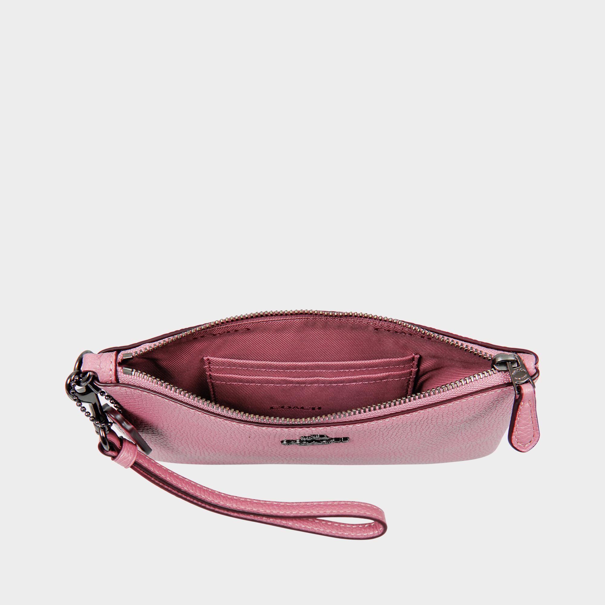 Petite pochette wrislet en cuir de veau rose Petite pochette wrislet en cuir de veau rose