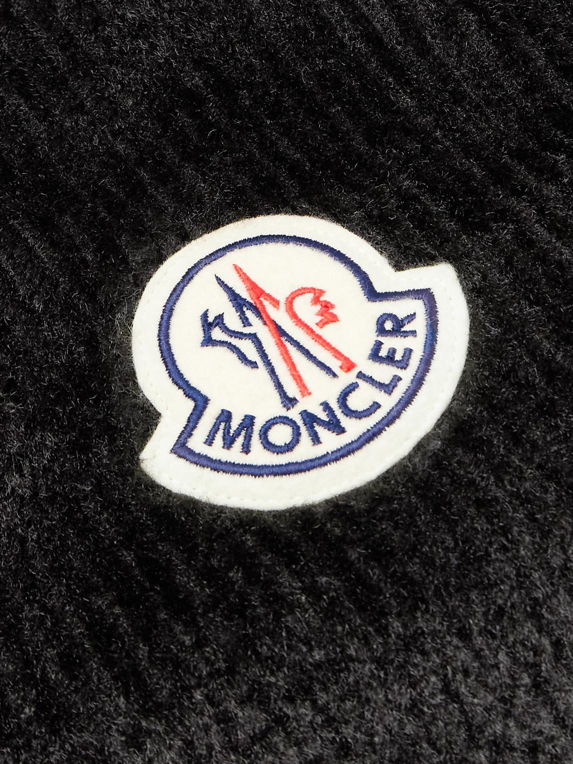 Moncler jacket deals symbol