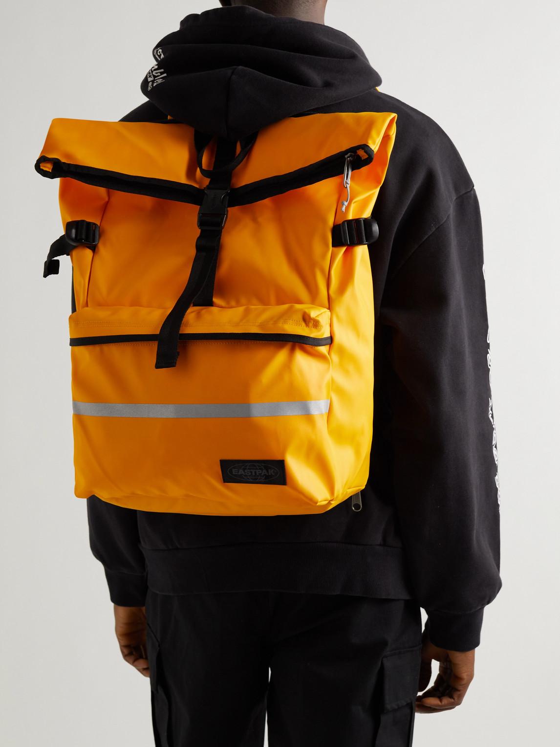 Eastpak Maclo Tarp Young Coated-canvas Cycling Backpack in Orange for Men |  Lyst UK