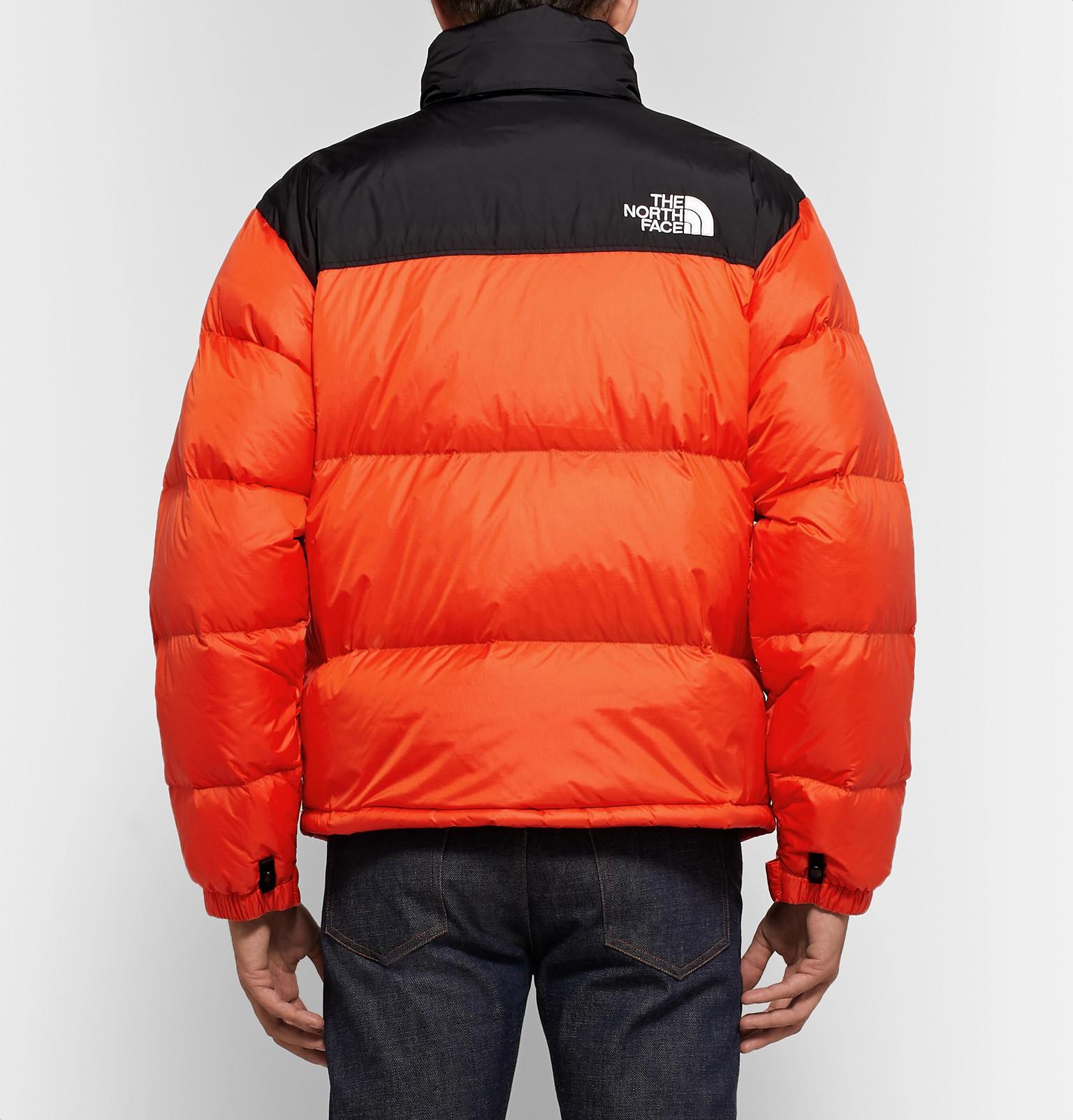 north face orange and black jacket