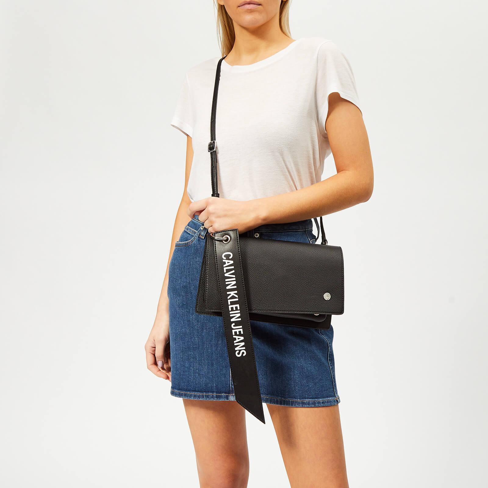 Calvin Klein Logo Banner Cross Body Flap Bag in Black - Lyst