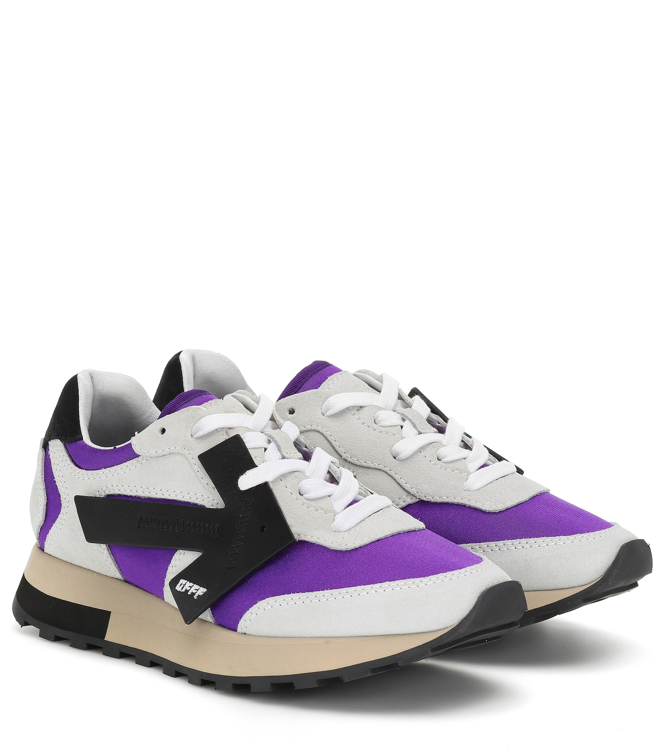 purple and white sneakers