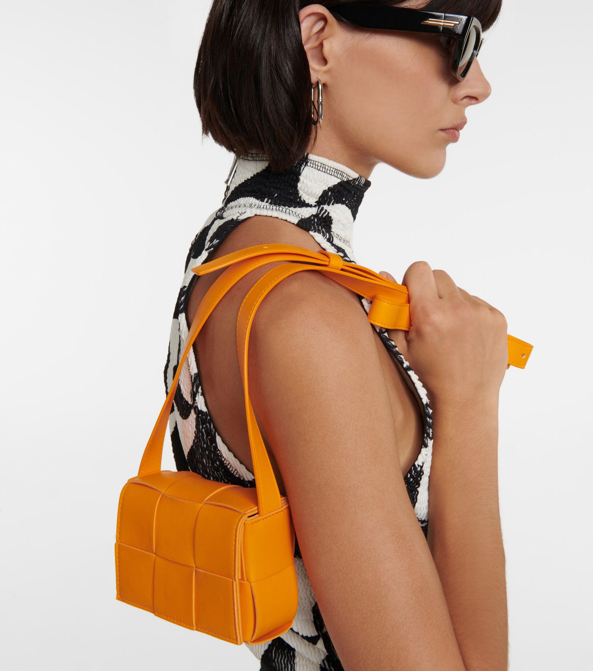 Bottega Veneta Cassette Mini Leather Crossbody Bag in Orange