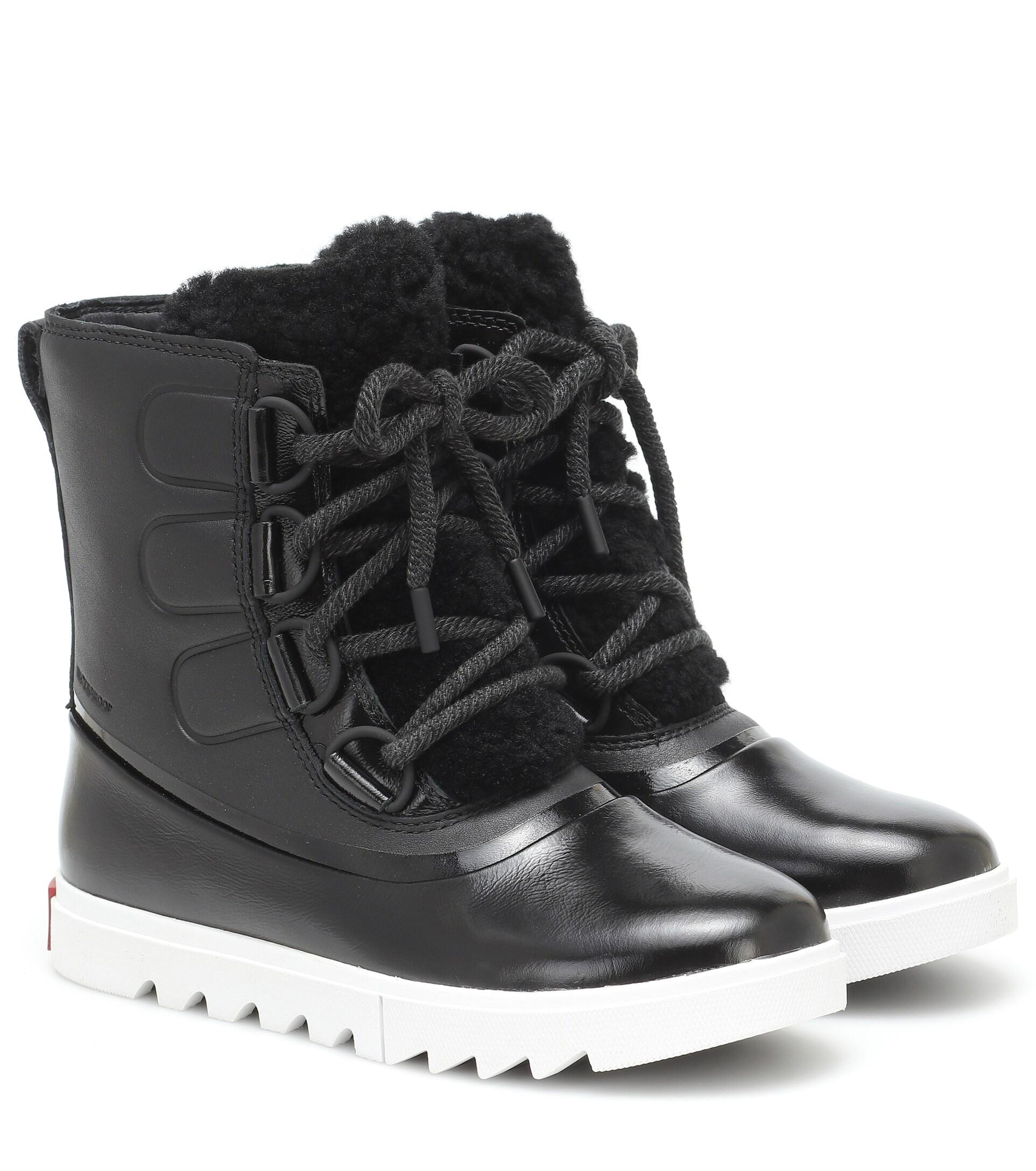 Sorel Joan Of Arctic Next Lite Leather Snow Boots in Black | Lyst