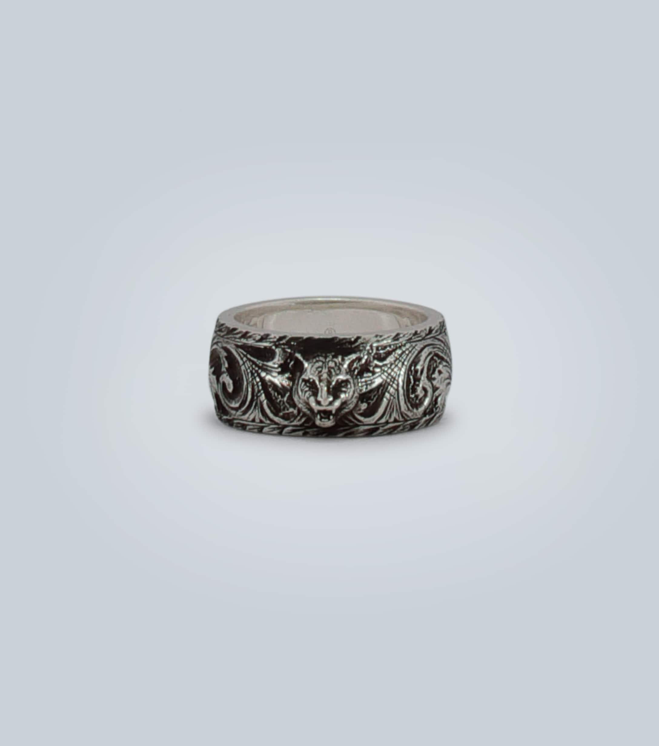 thin silver ring with feline head