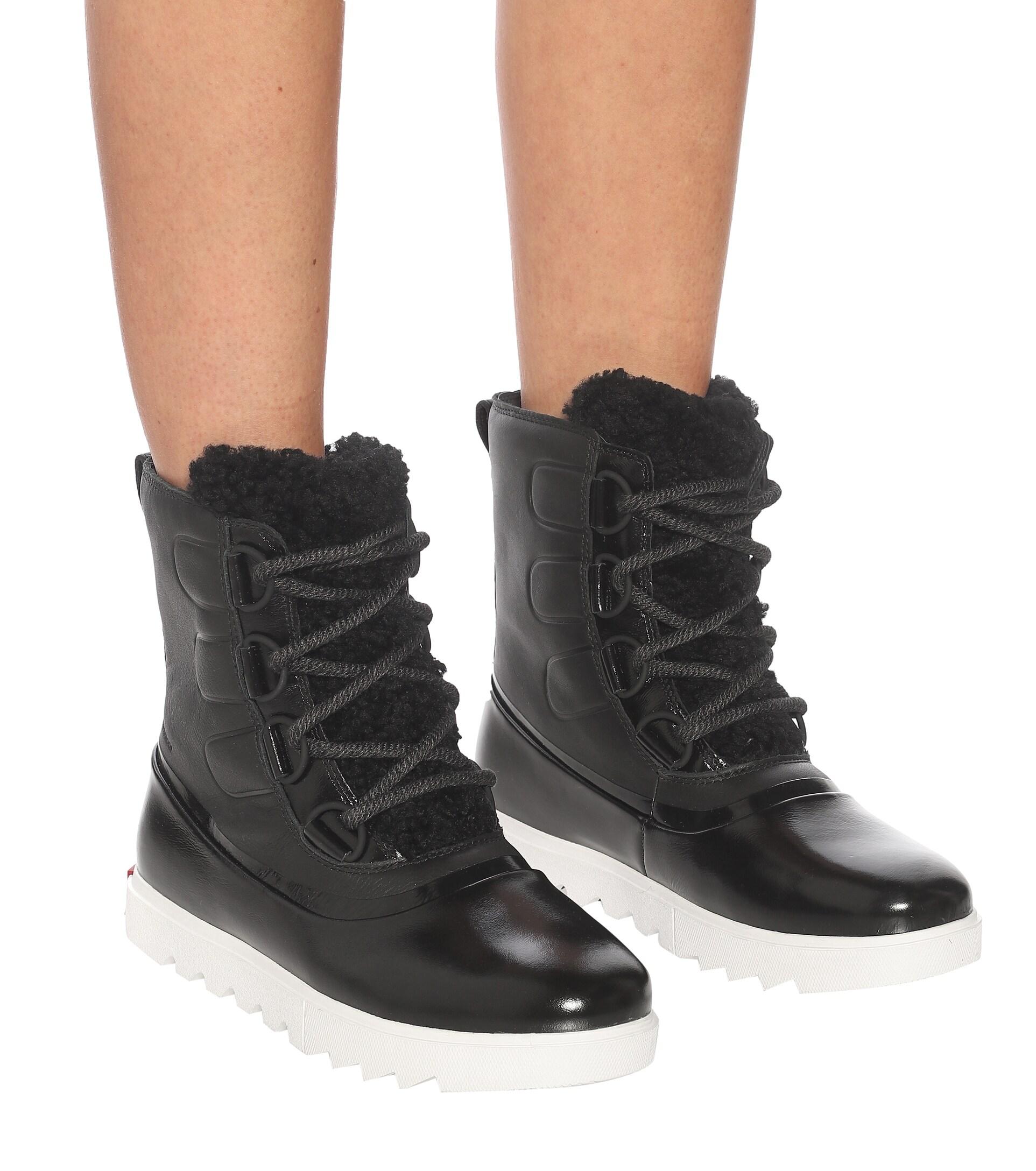 Sorel Joan Of Arctic Next Lite Leather Snow Boots in Black | Lyst