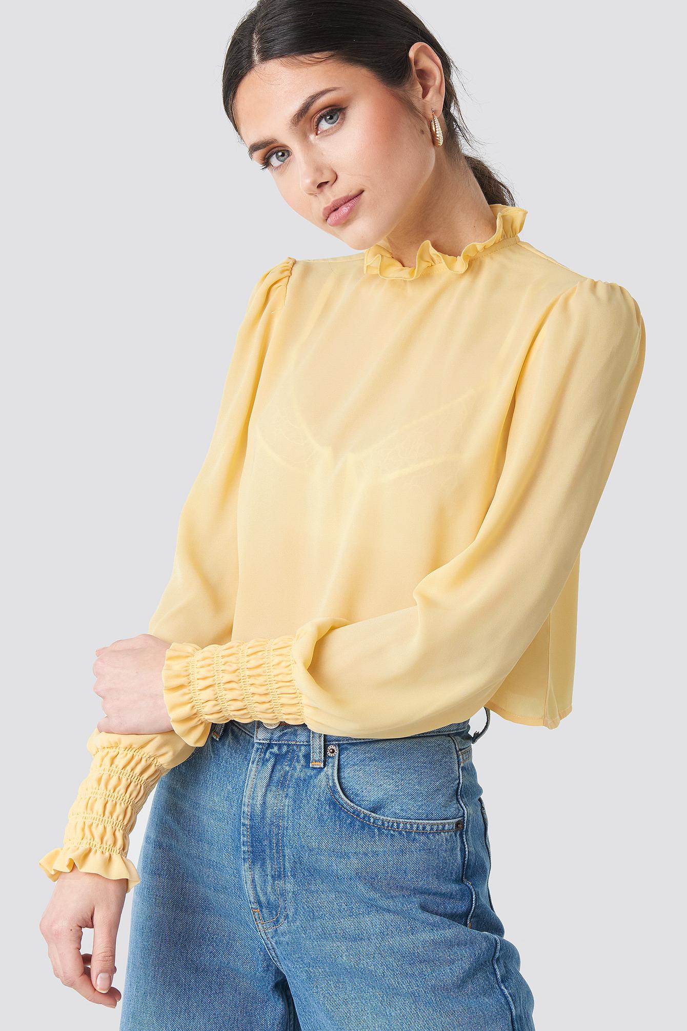 yellow high neck blouse