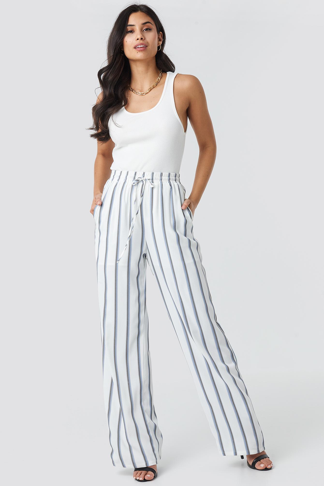 white pants with blue stripes