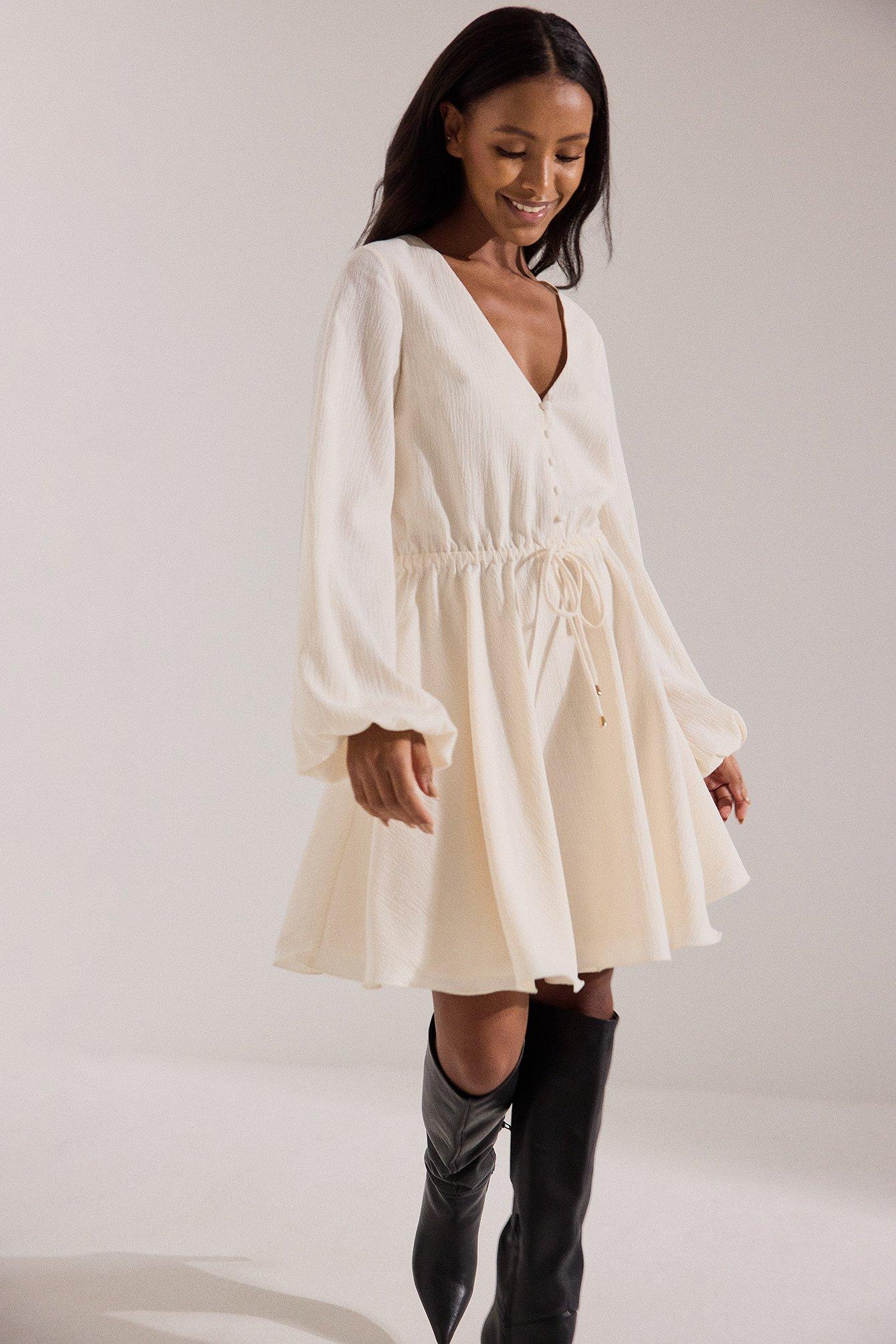 NA-KD Offwhite Flowy Long Sleeve Mini Dress in Natural | Lyst