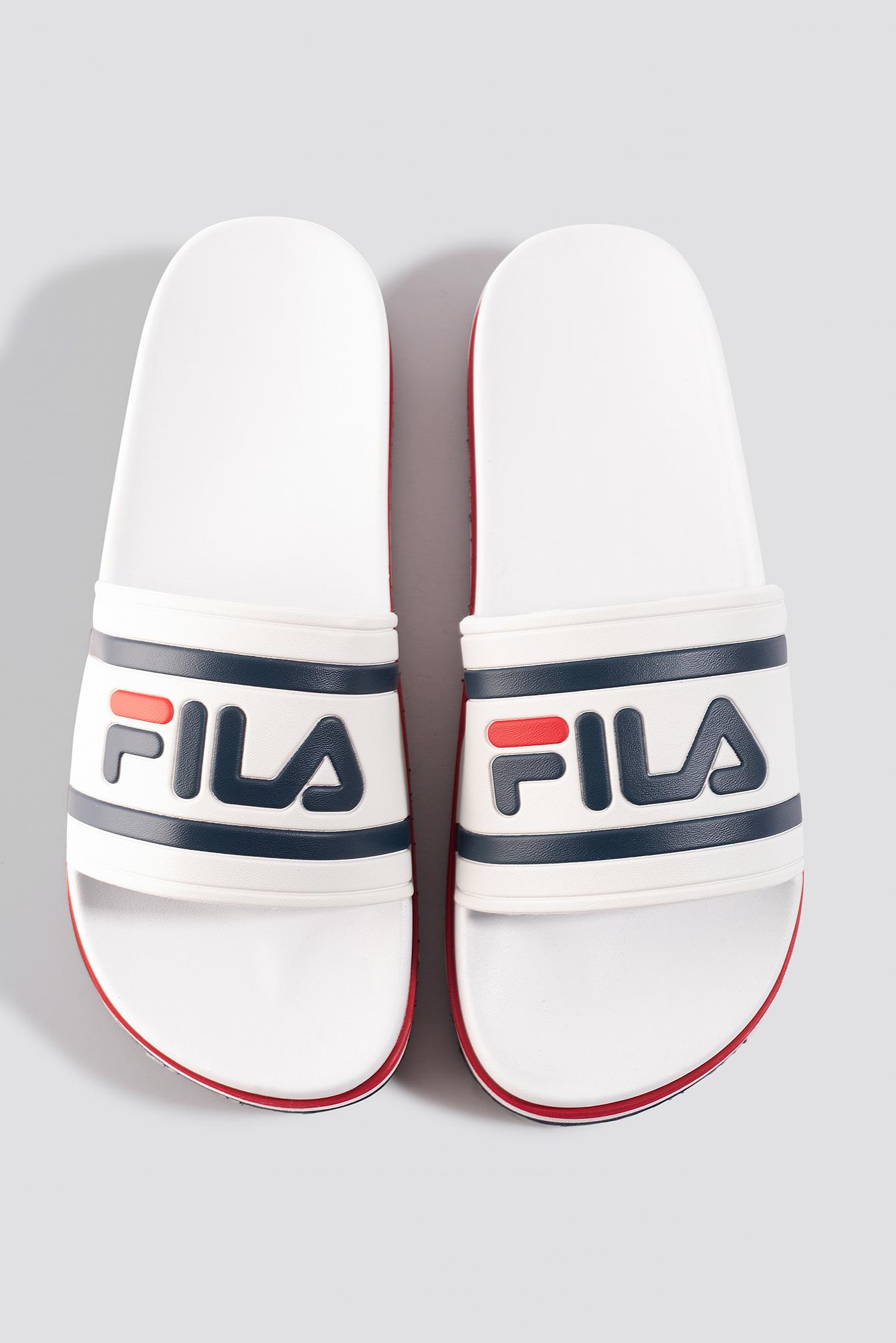 white fila slides