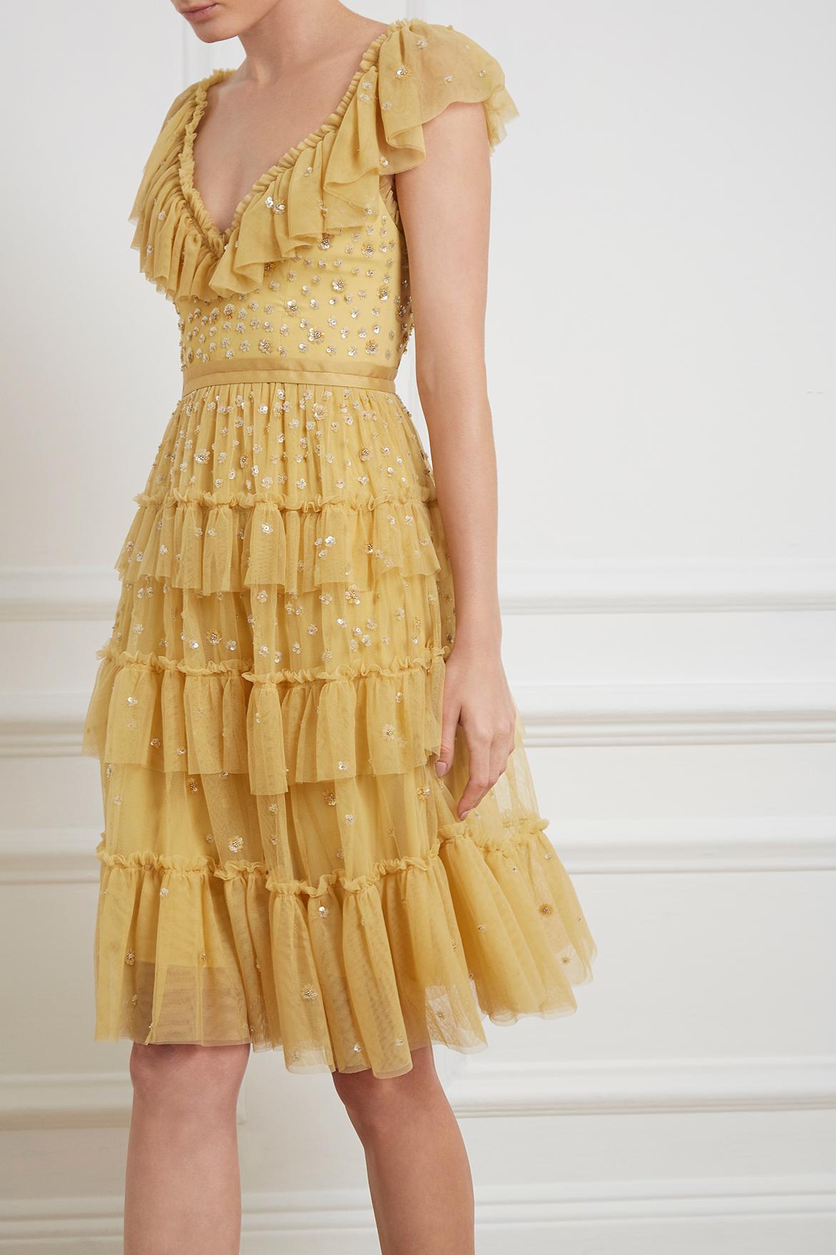 needle and thread yellow dress