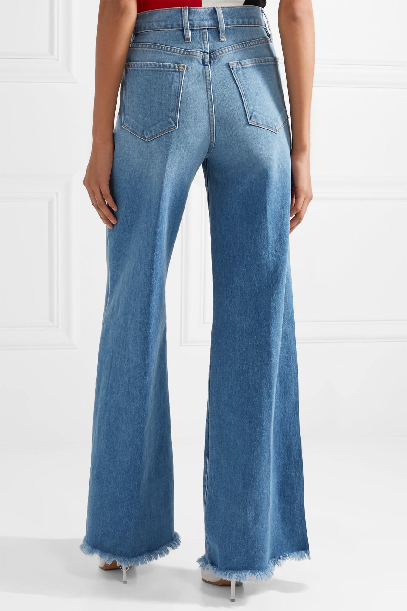 FRAME Frayed Faded High-rise Wide-leg Jeans Mid Denim in Light Denim ...