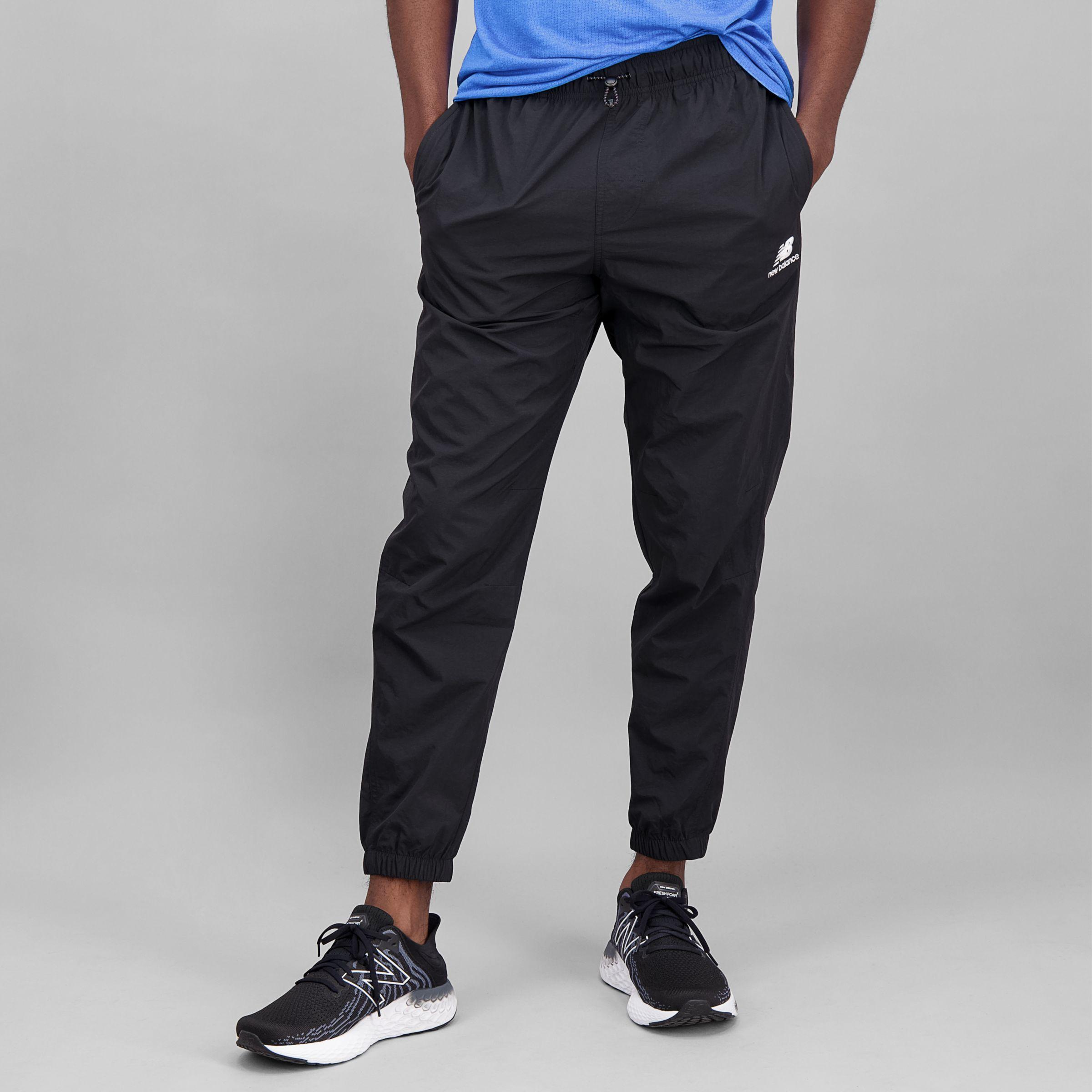 New Balance Nb Athletics Higher Learning Wind Trousers in Black